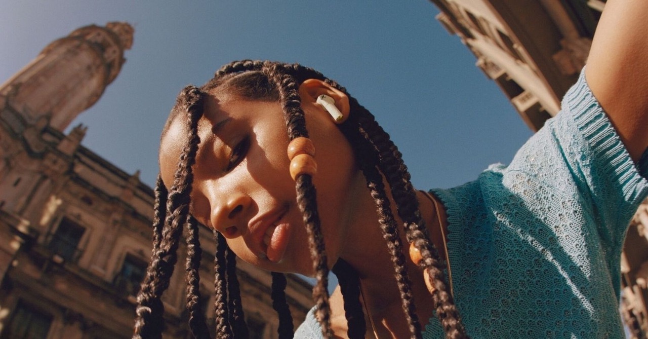 person wearing earbuds outdoors