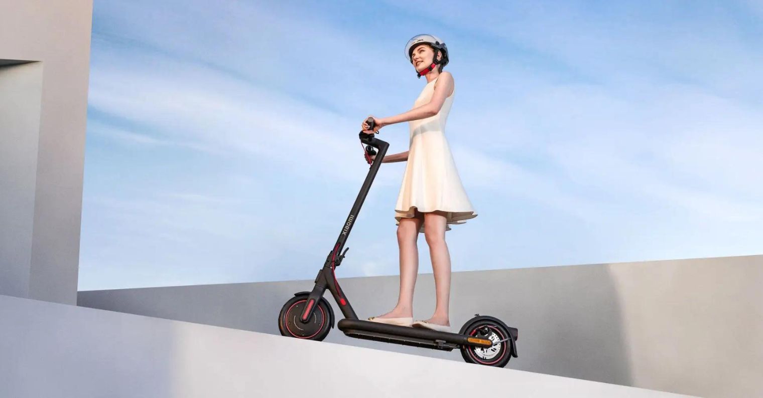 woman riding electric scooter