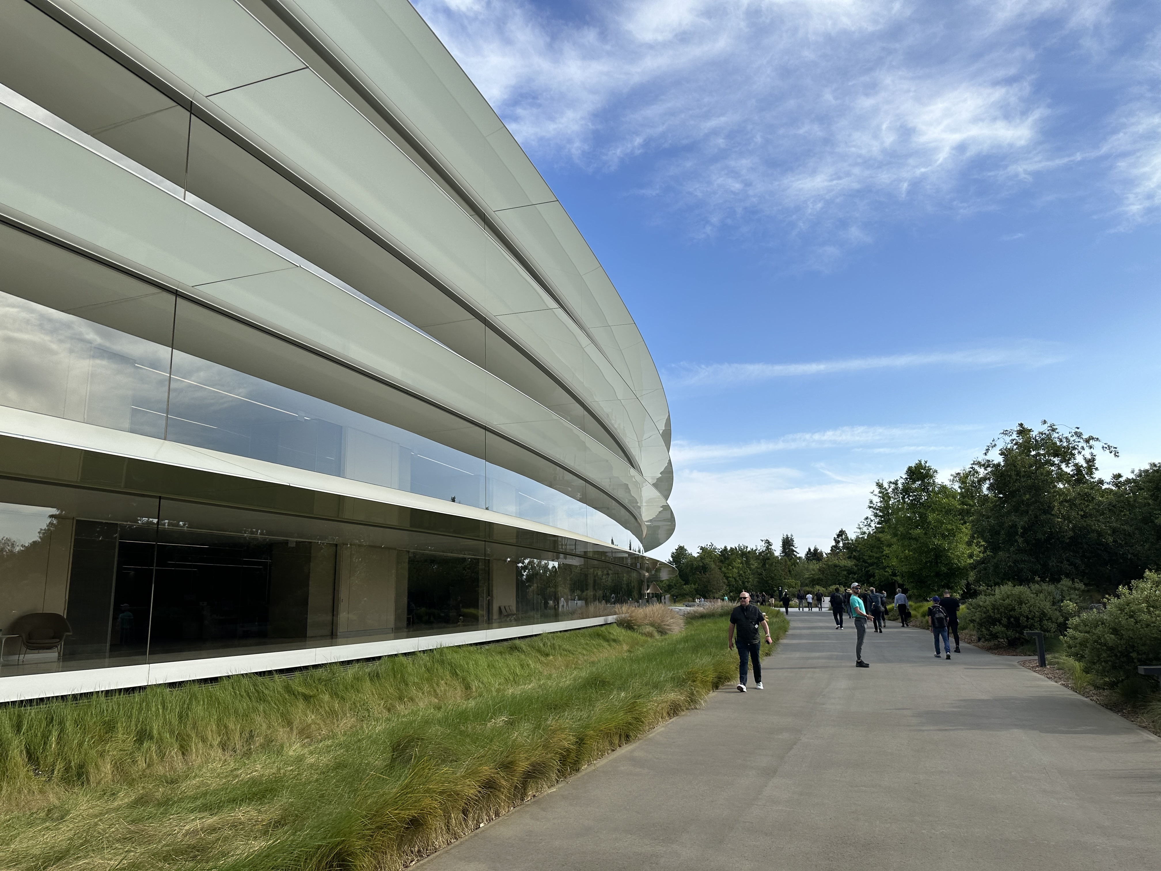 curved glass building pathway