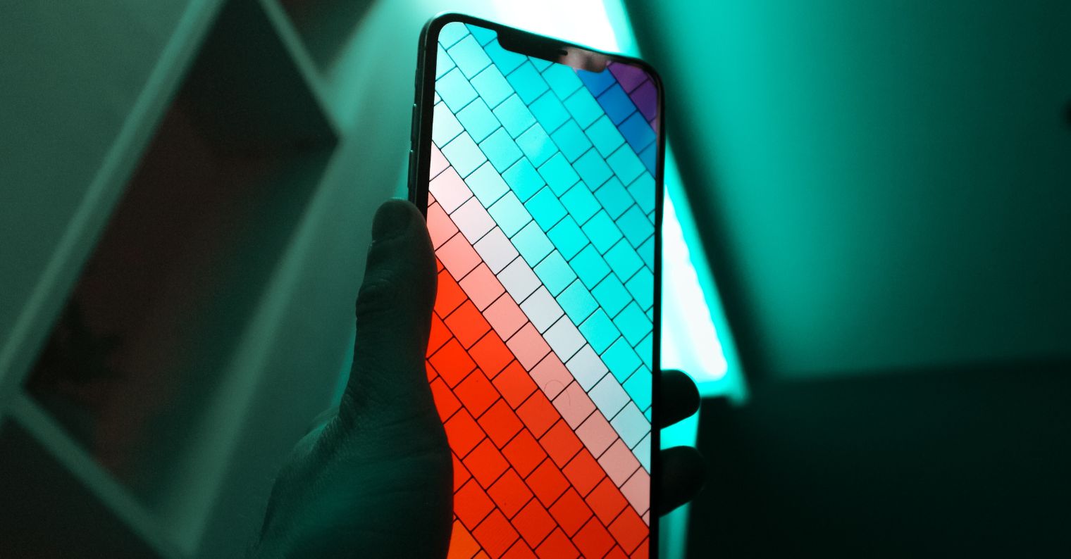 hand holding smartphone colorful screen