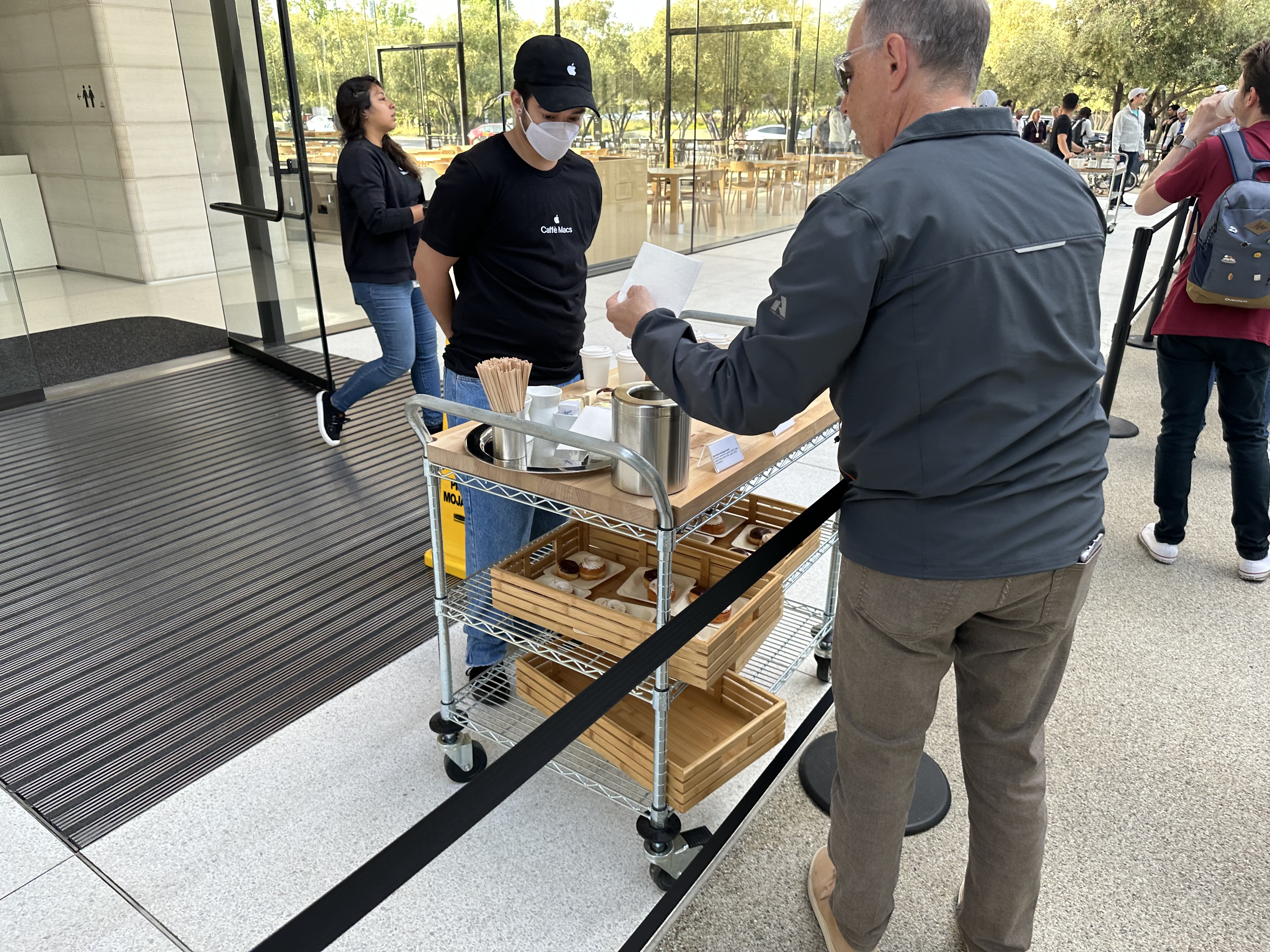 man serving coffee outside