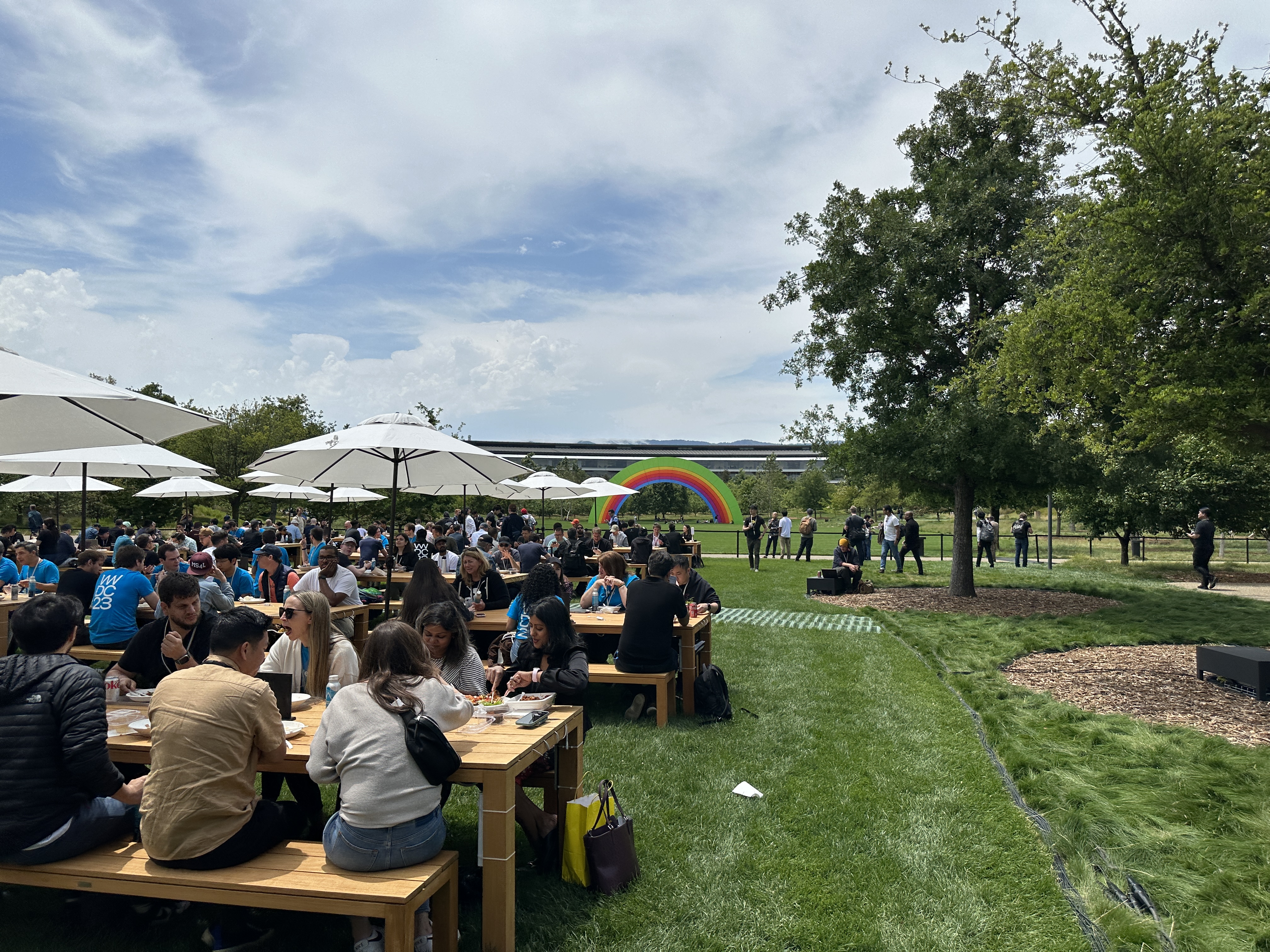 outdoor gathering with rainbow