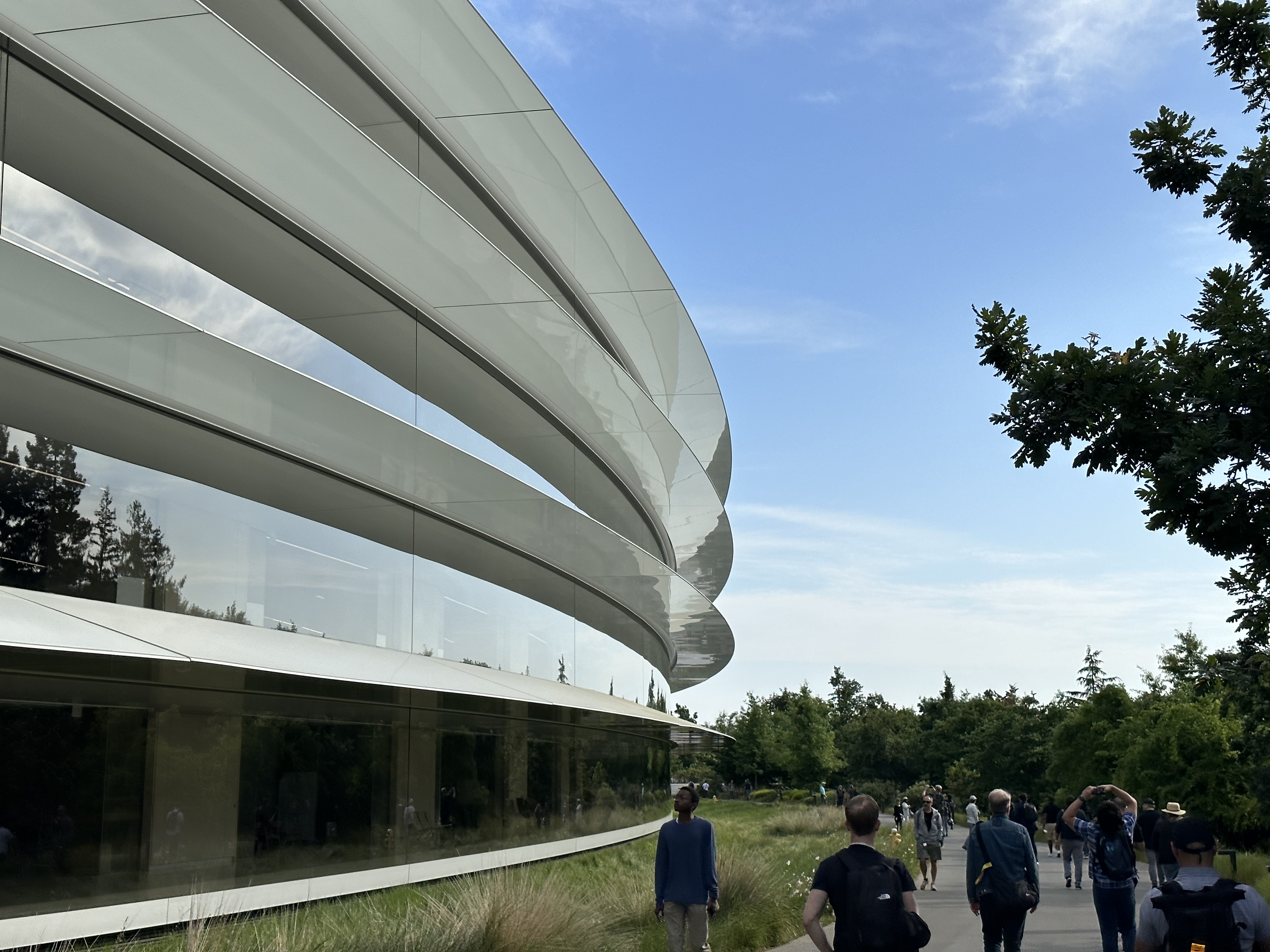 people walking along building