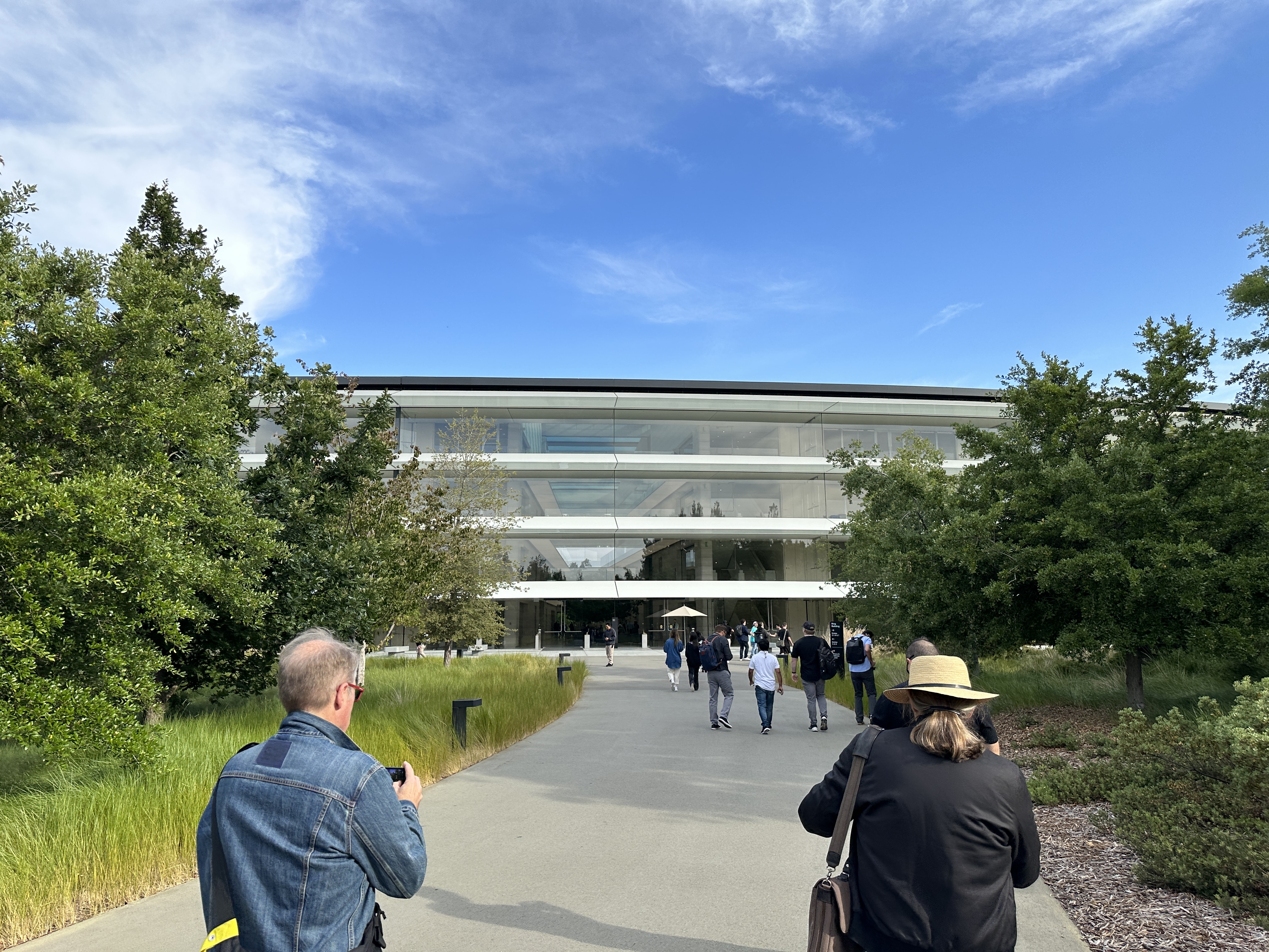people walking towards building