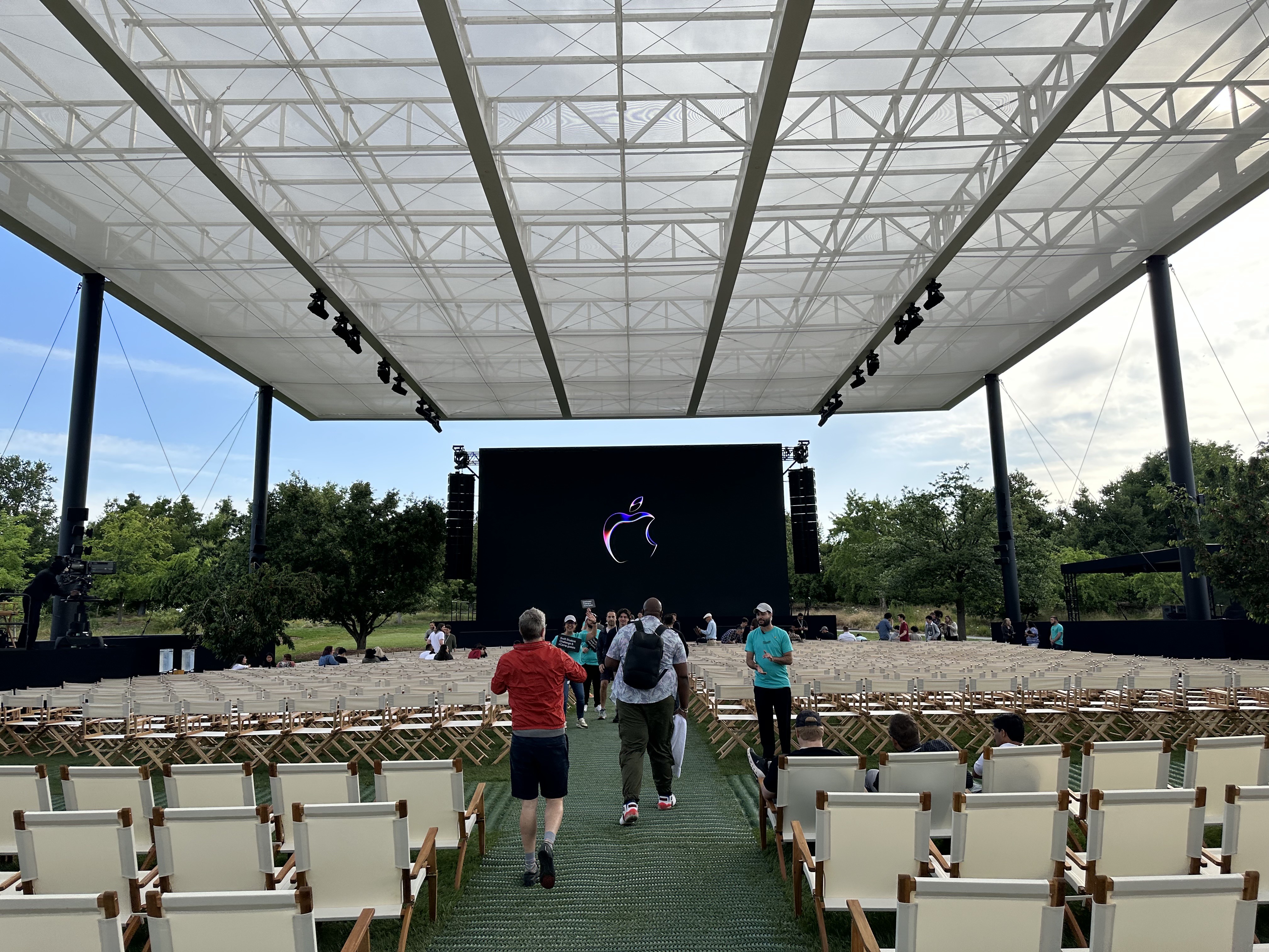 people walking towards screen