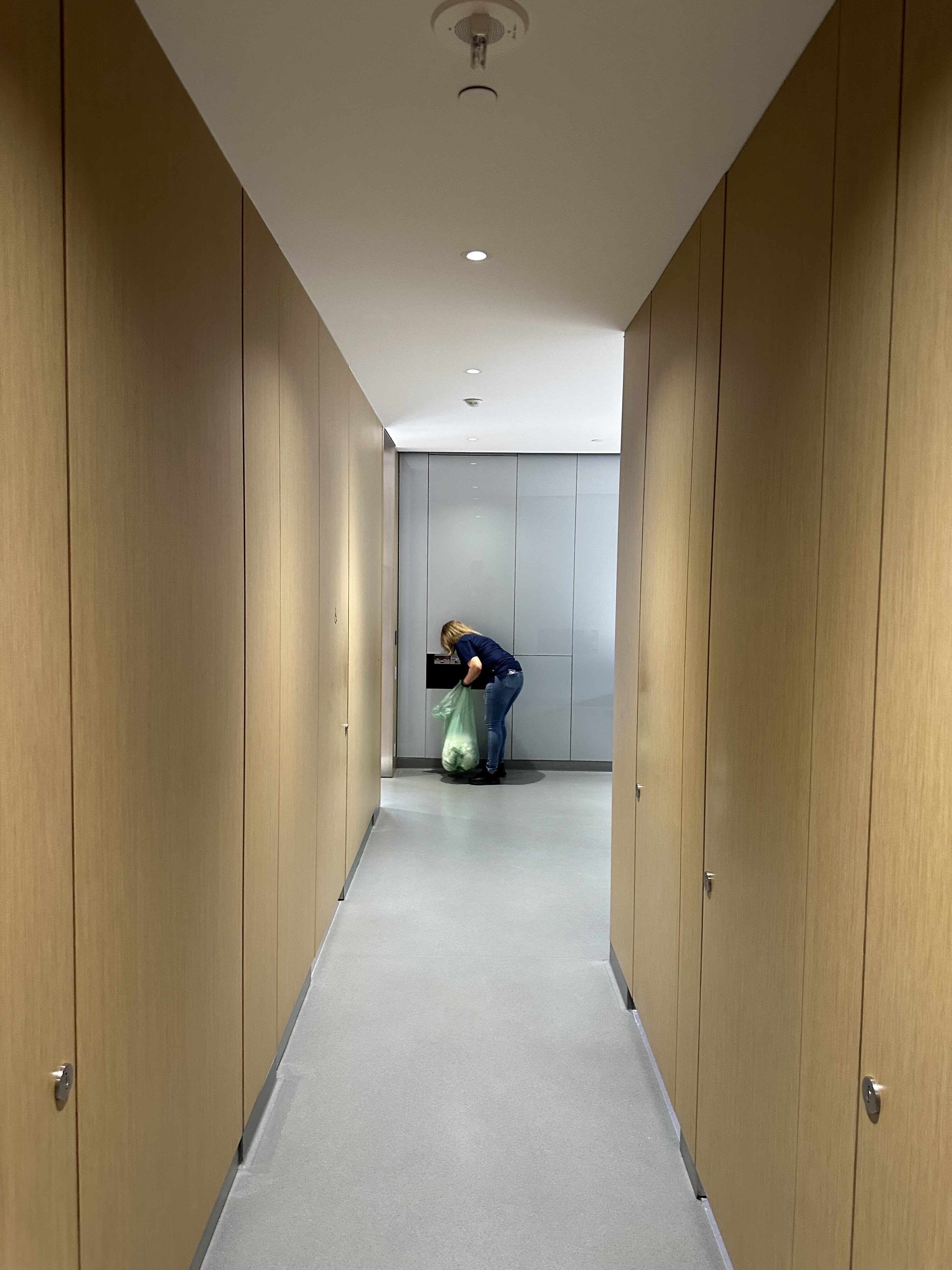 person cleaning hallway