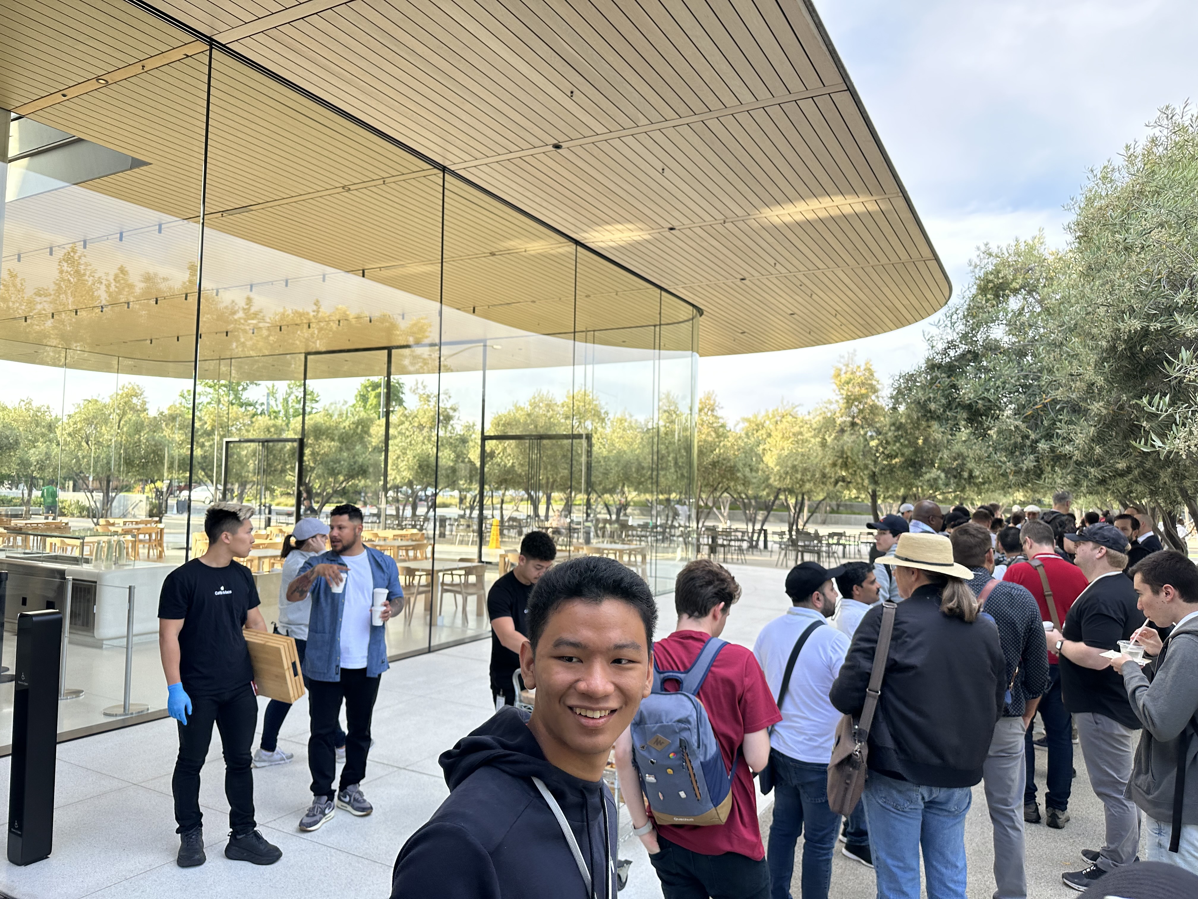 smiling man in crowd