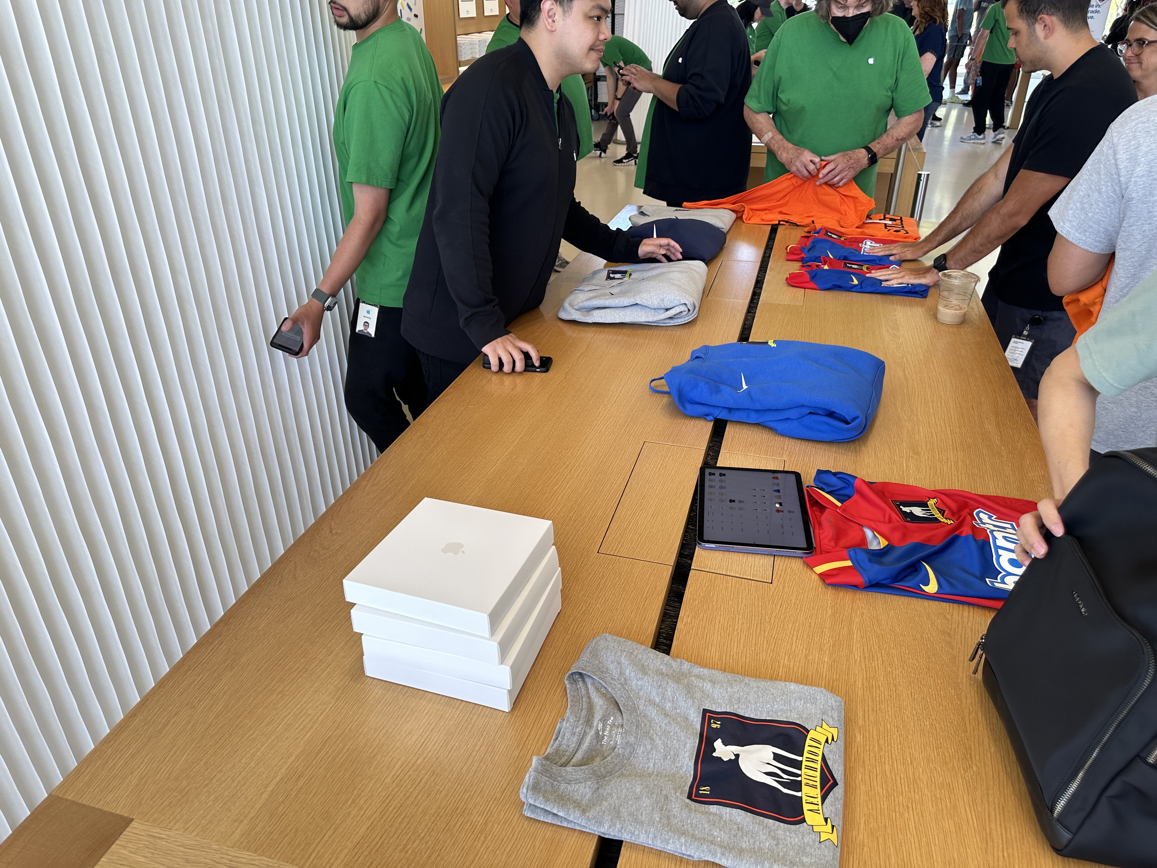 table with clothes and boxes