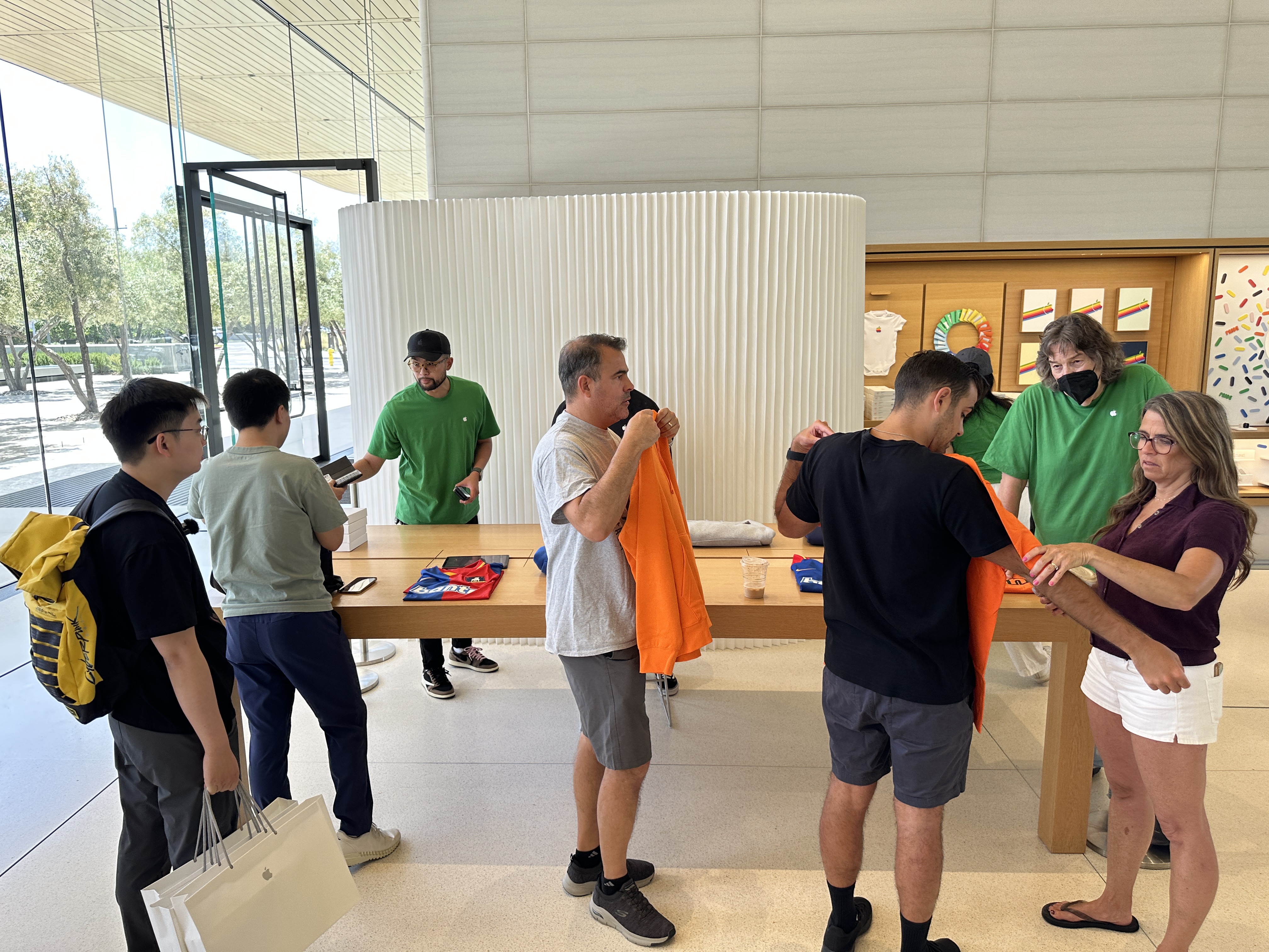 apple store staff assisting customers