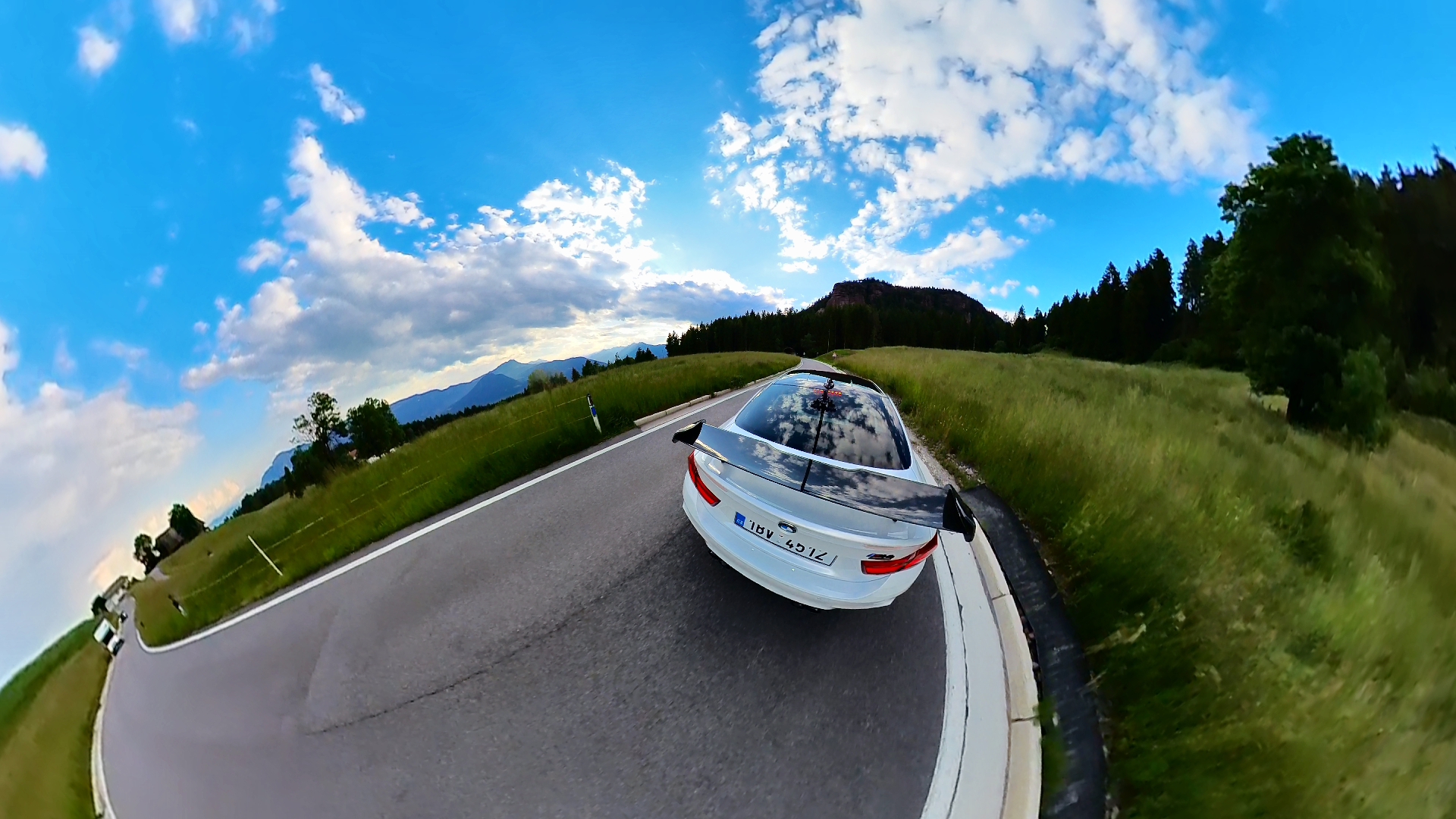 car on road with mountains