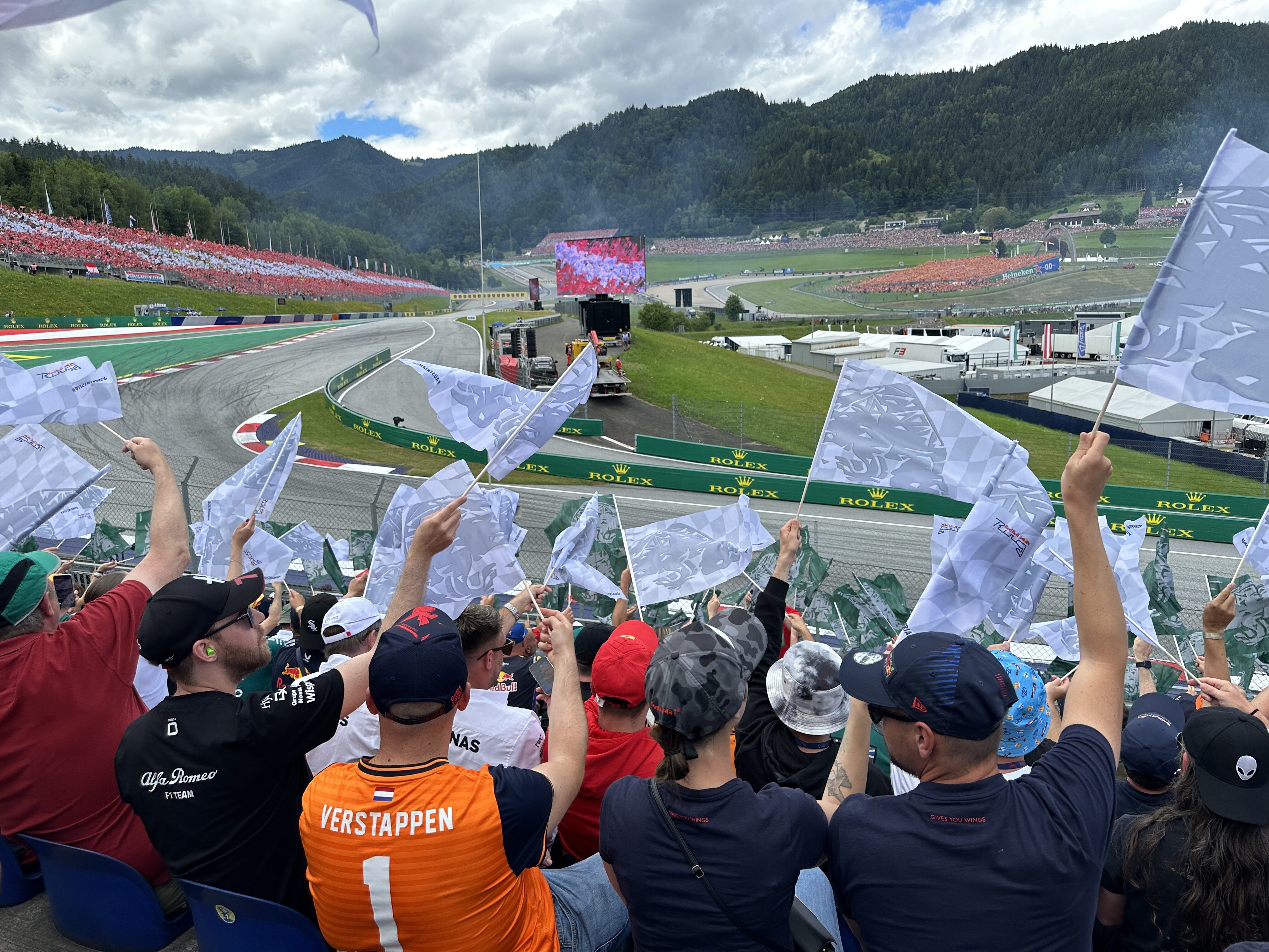 crowd waving flags at race