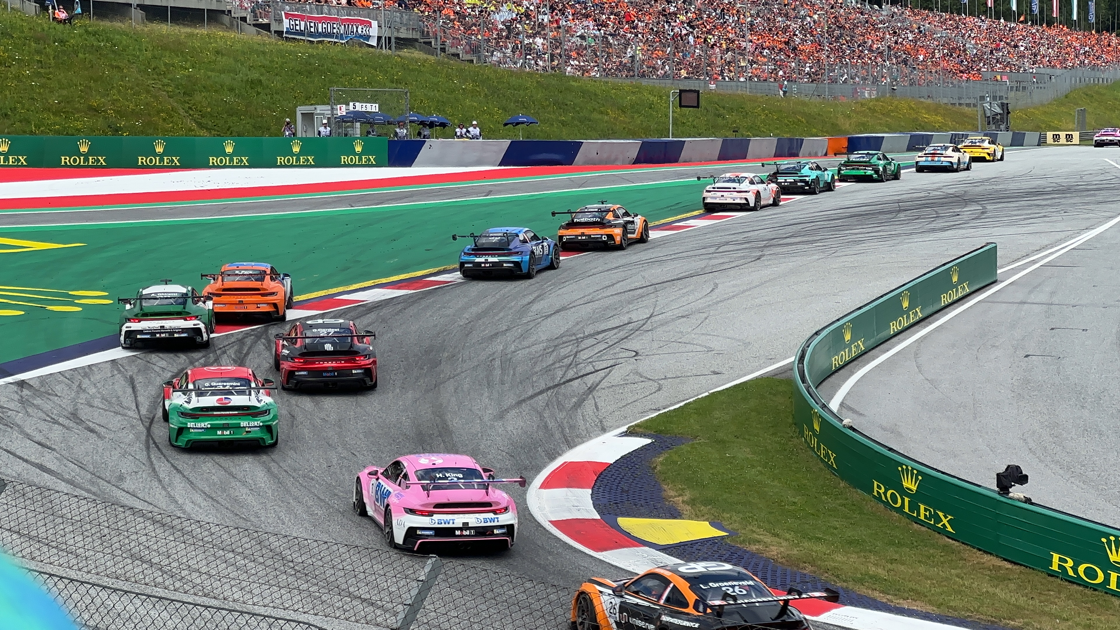 race cars on track turn