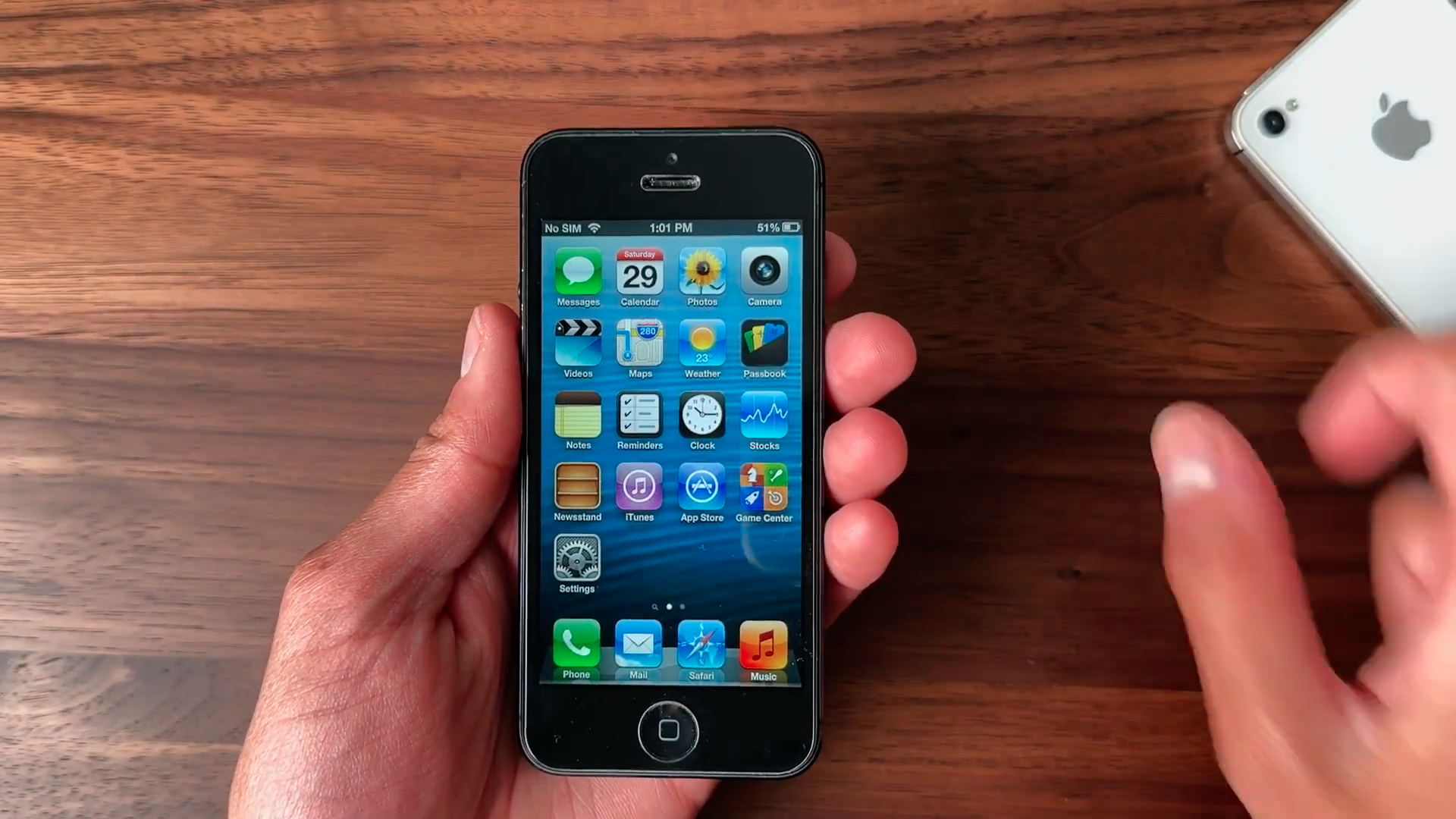 holding iphone on home screen