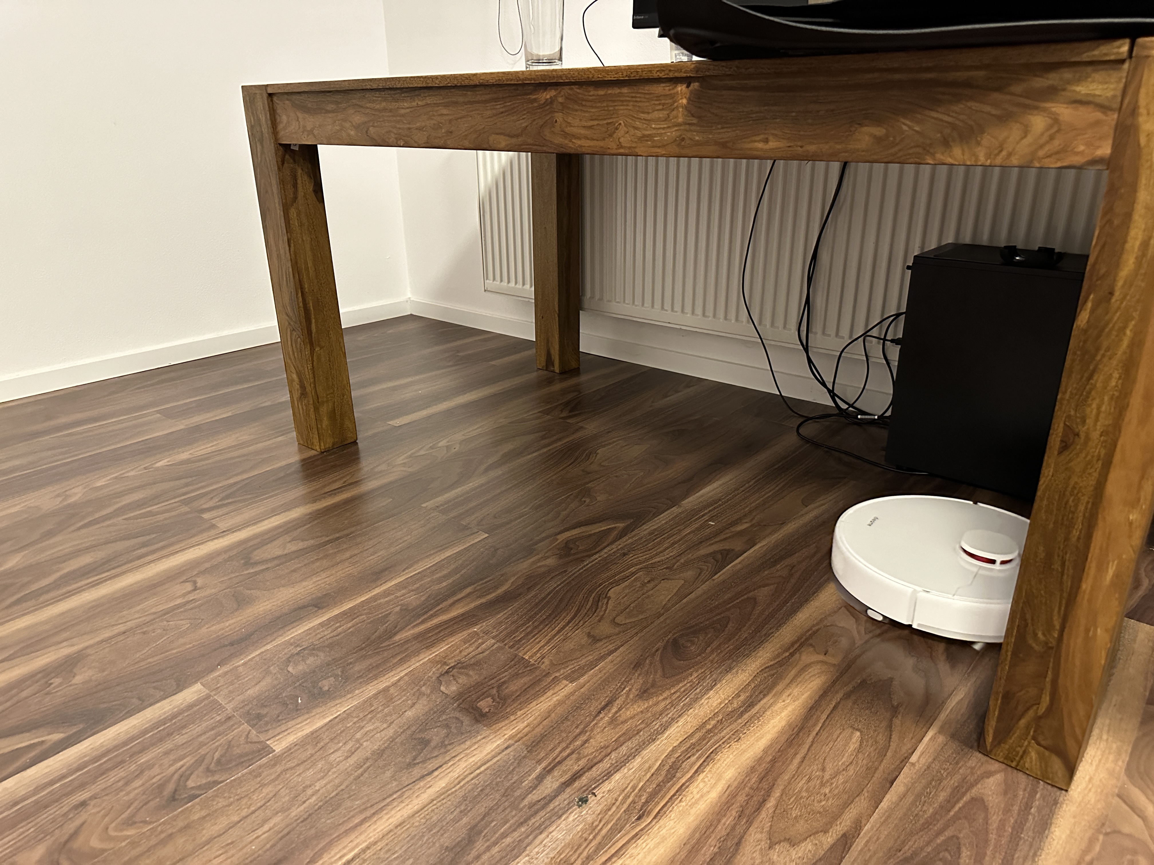 robot vacuum under table