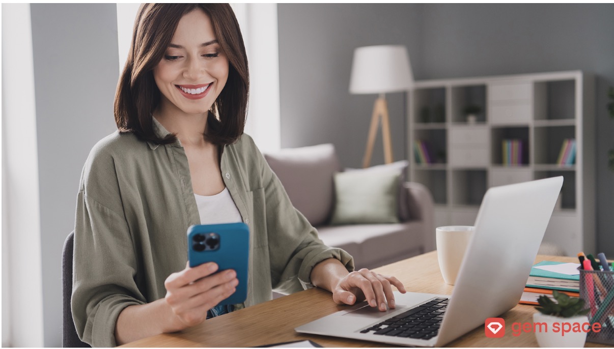 woman smiling phone laptop