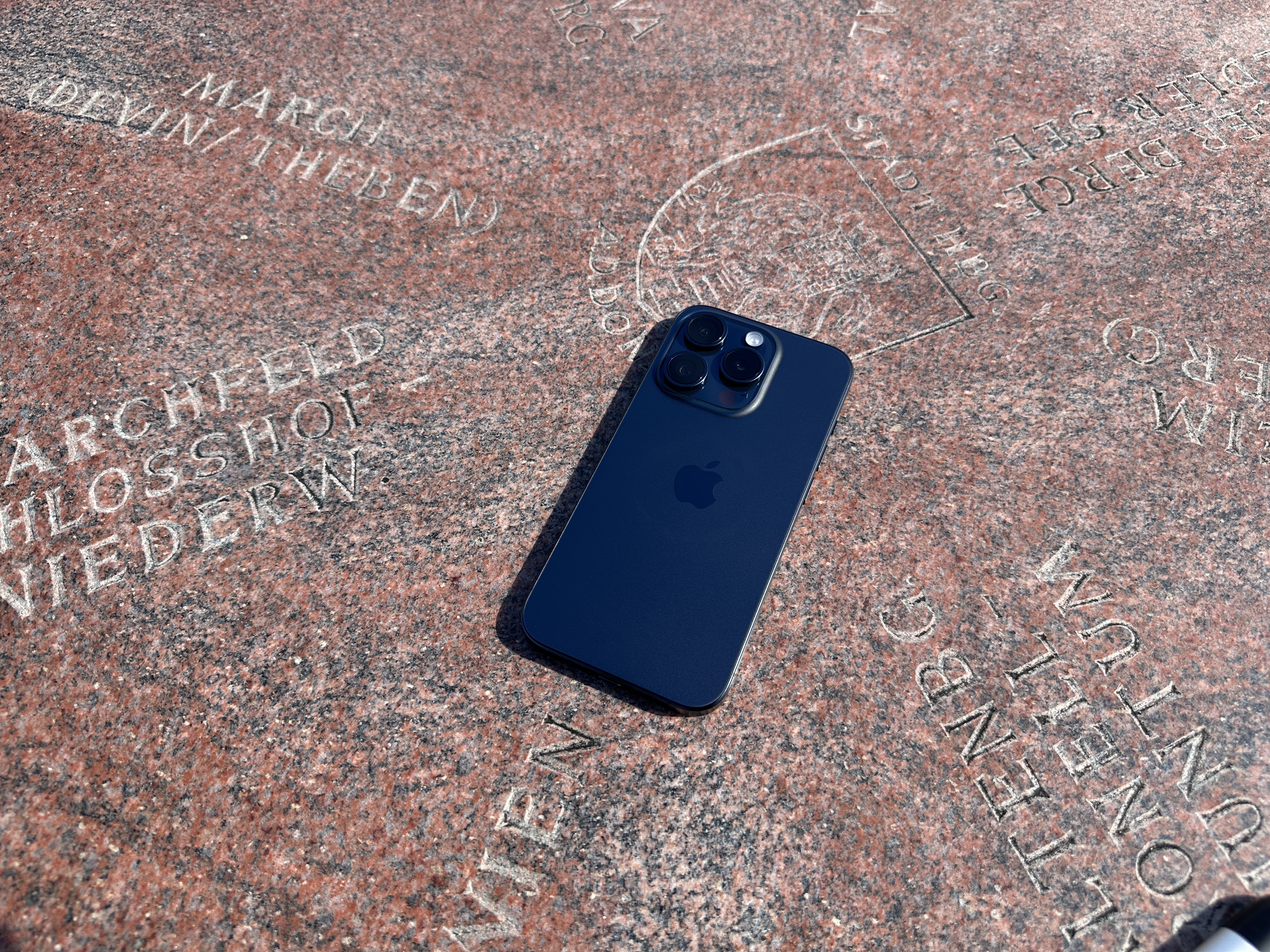 black phone on engraved stone