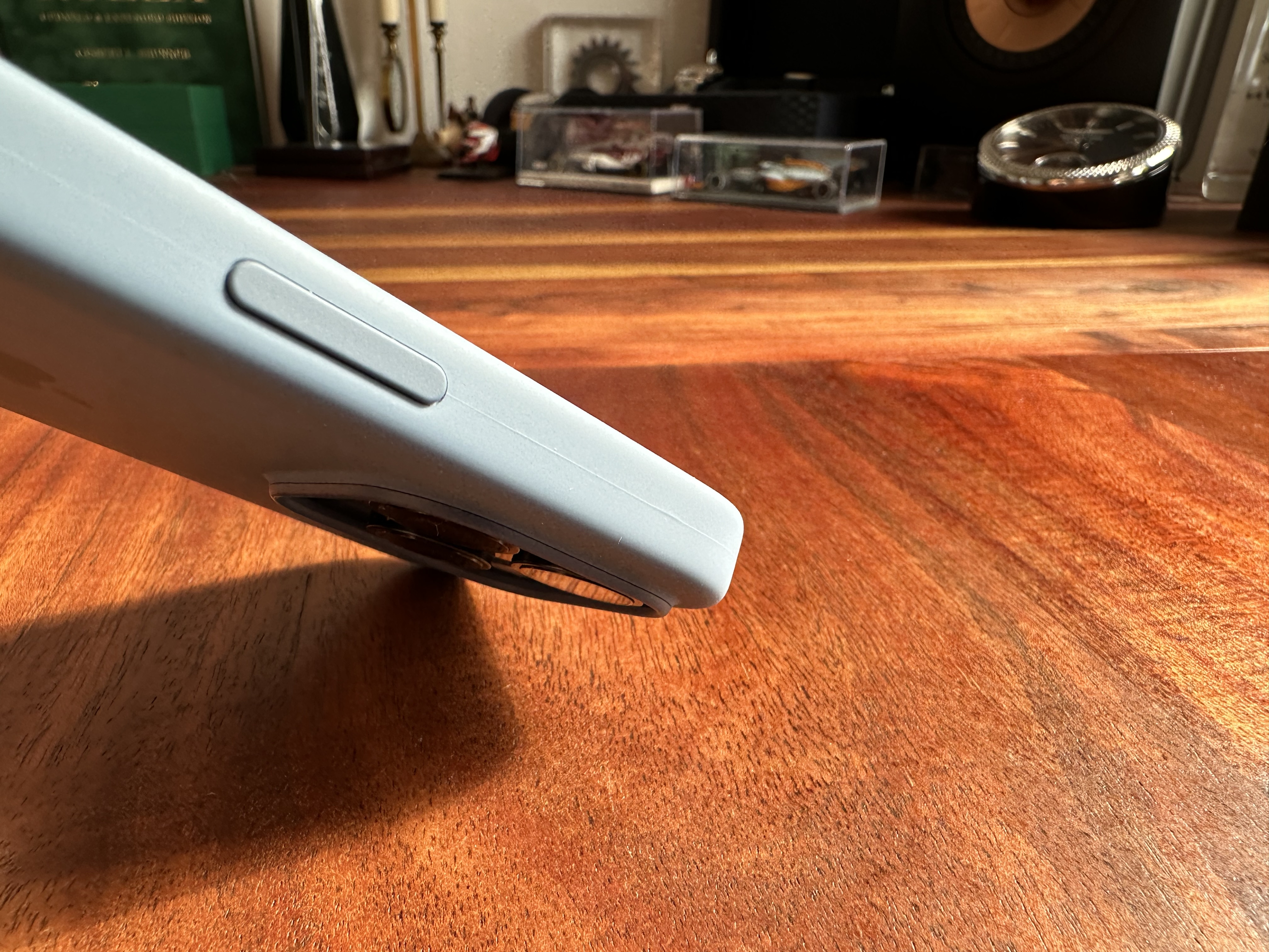 blue iphone bottom view on table