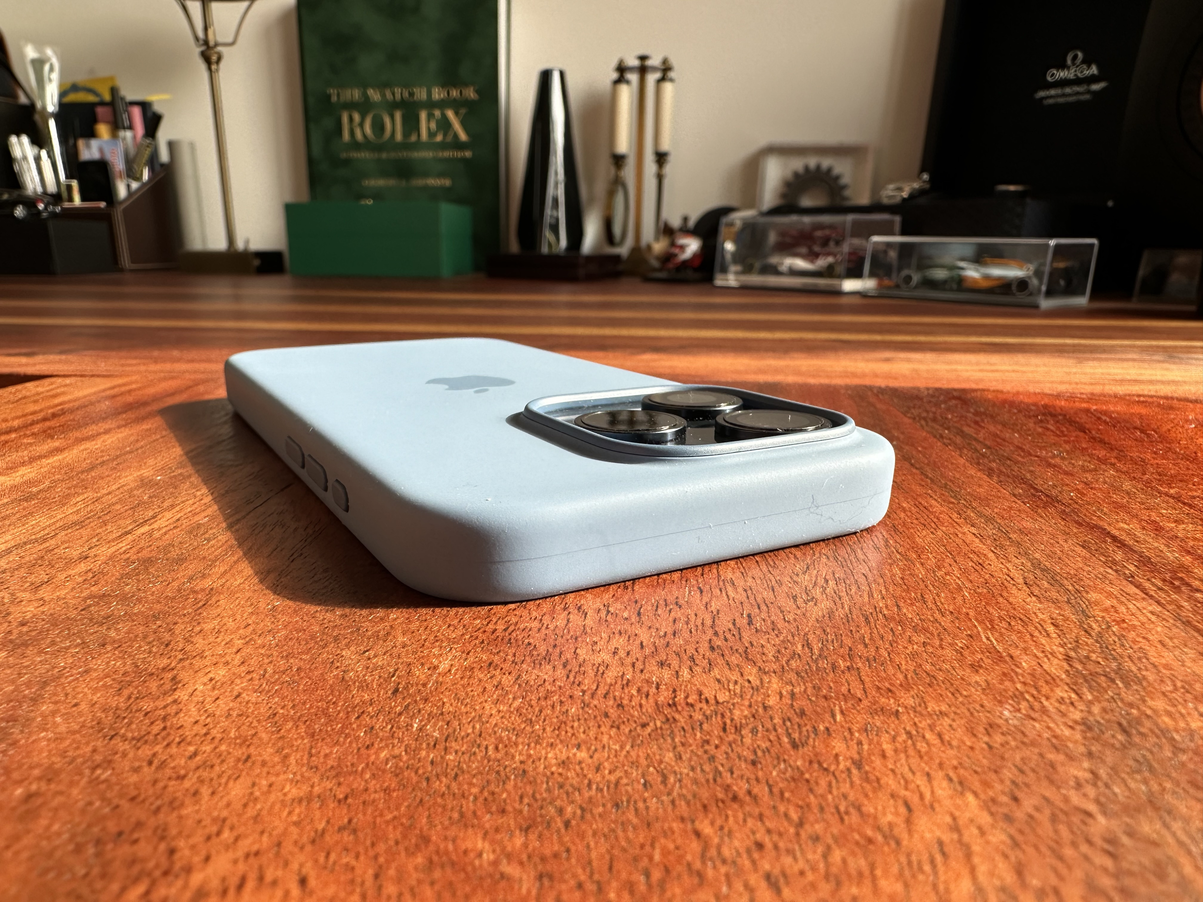 blue iphone side buttons on table