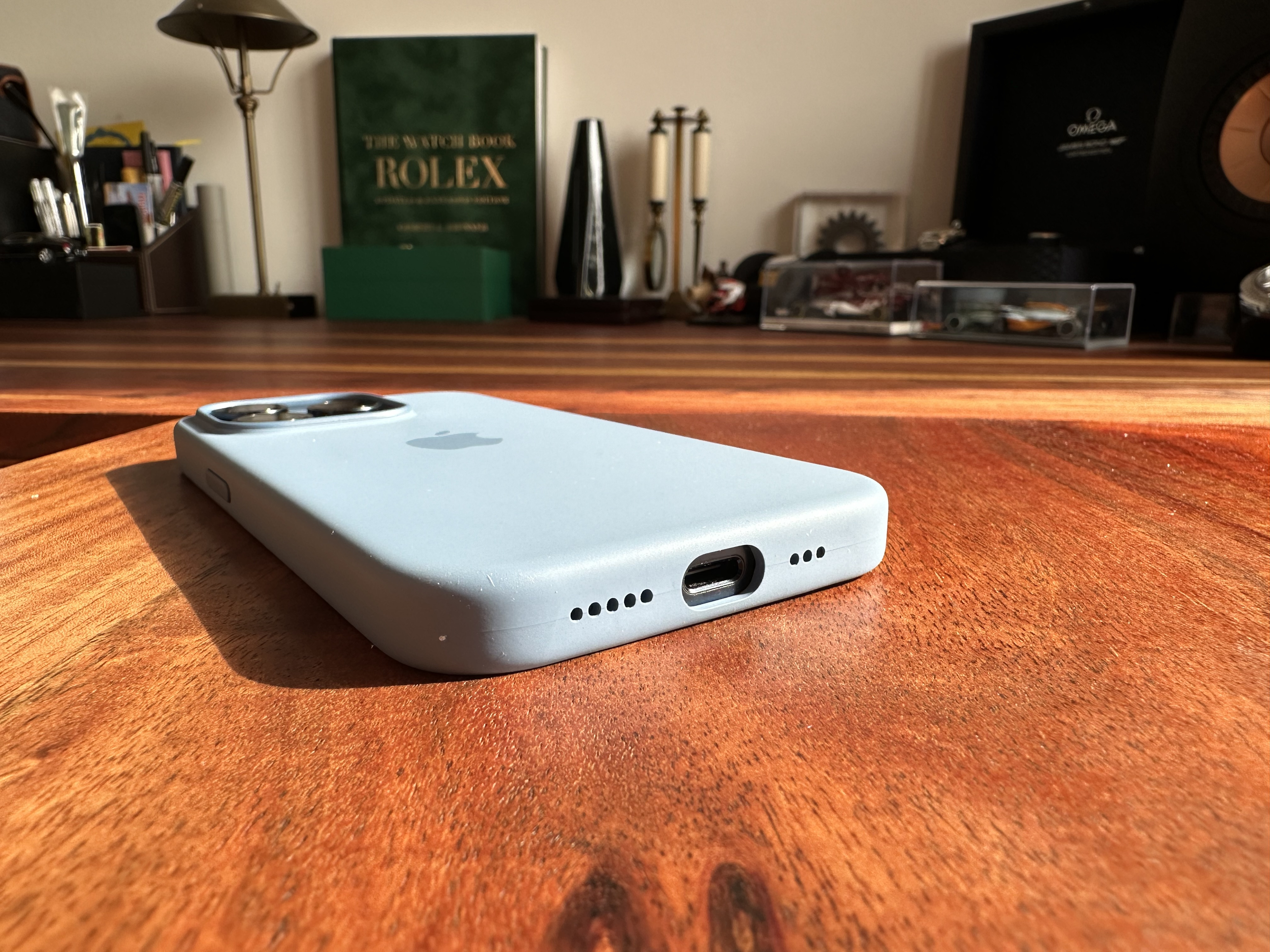 blue iphone side view on table