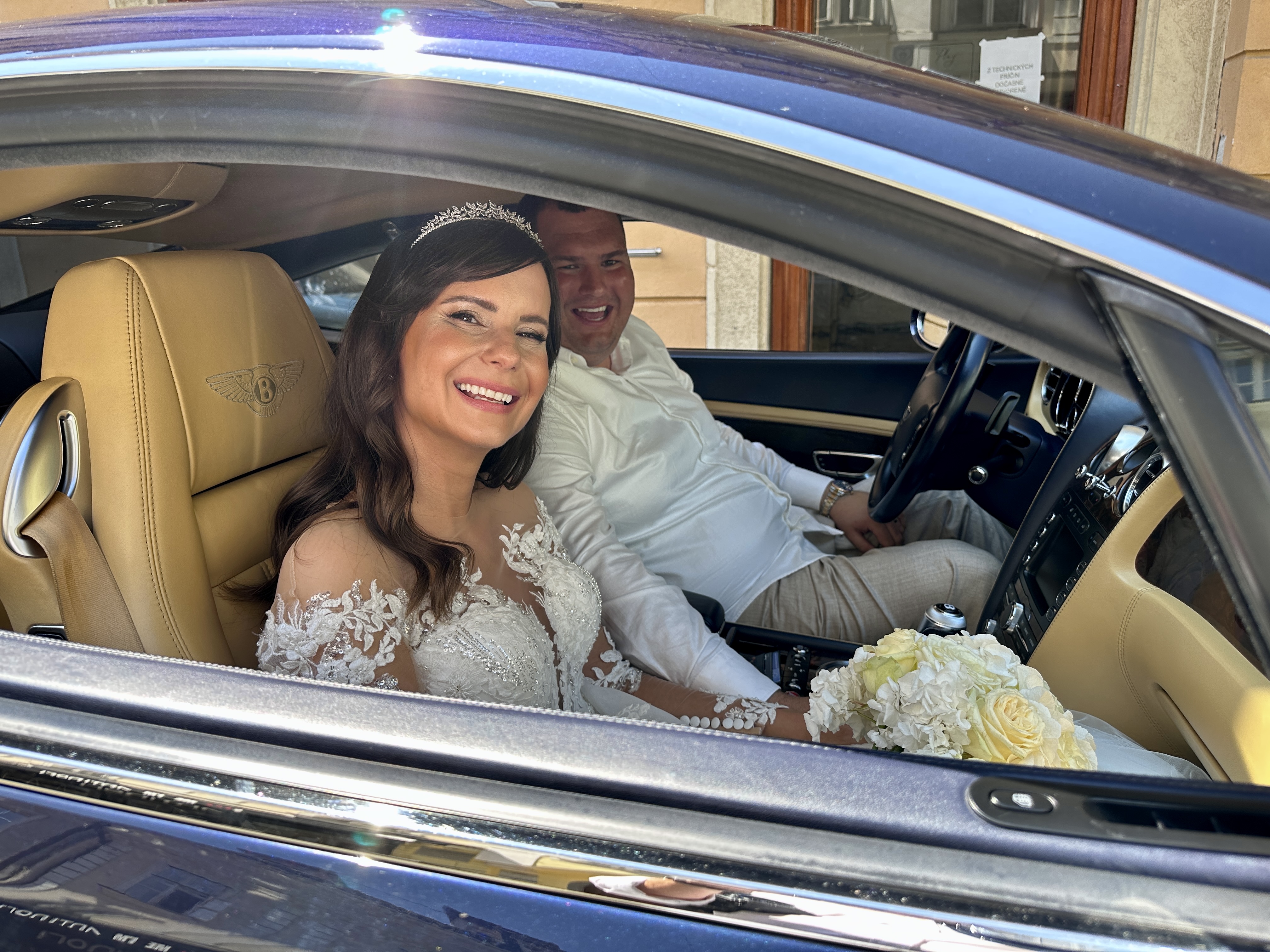 bride and groom in car