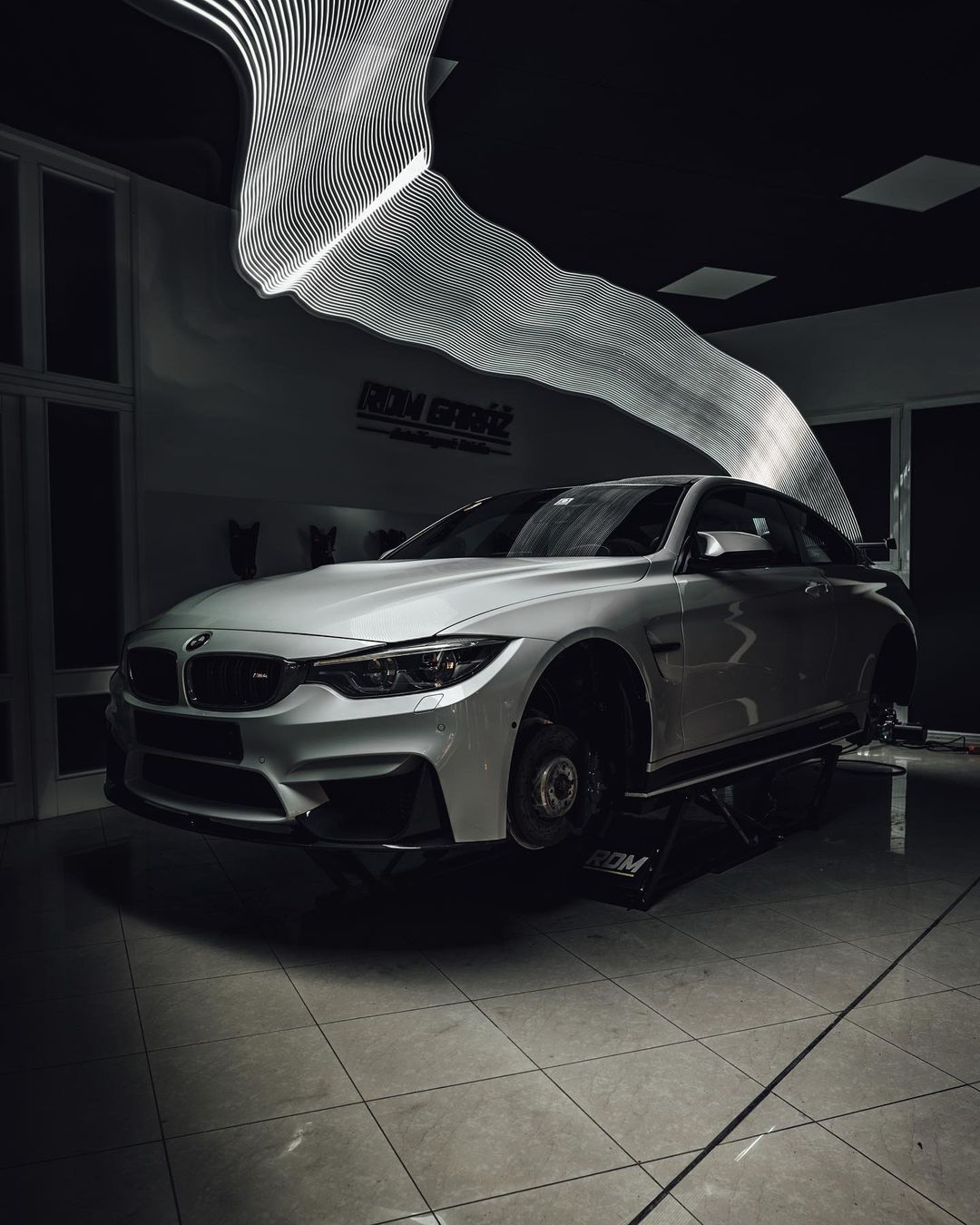 car on lift dark room