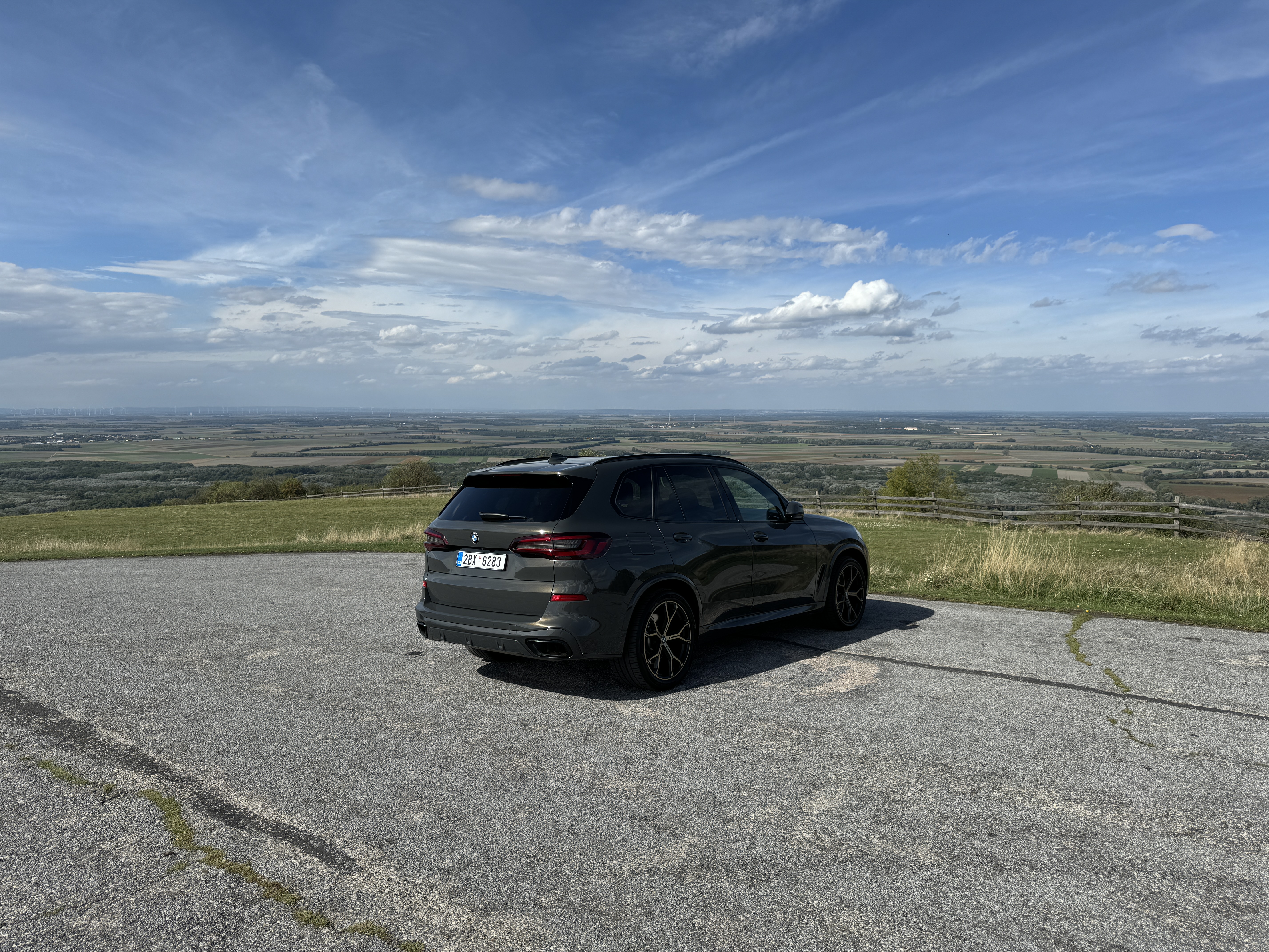 car on scenic hilltop