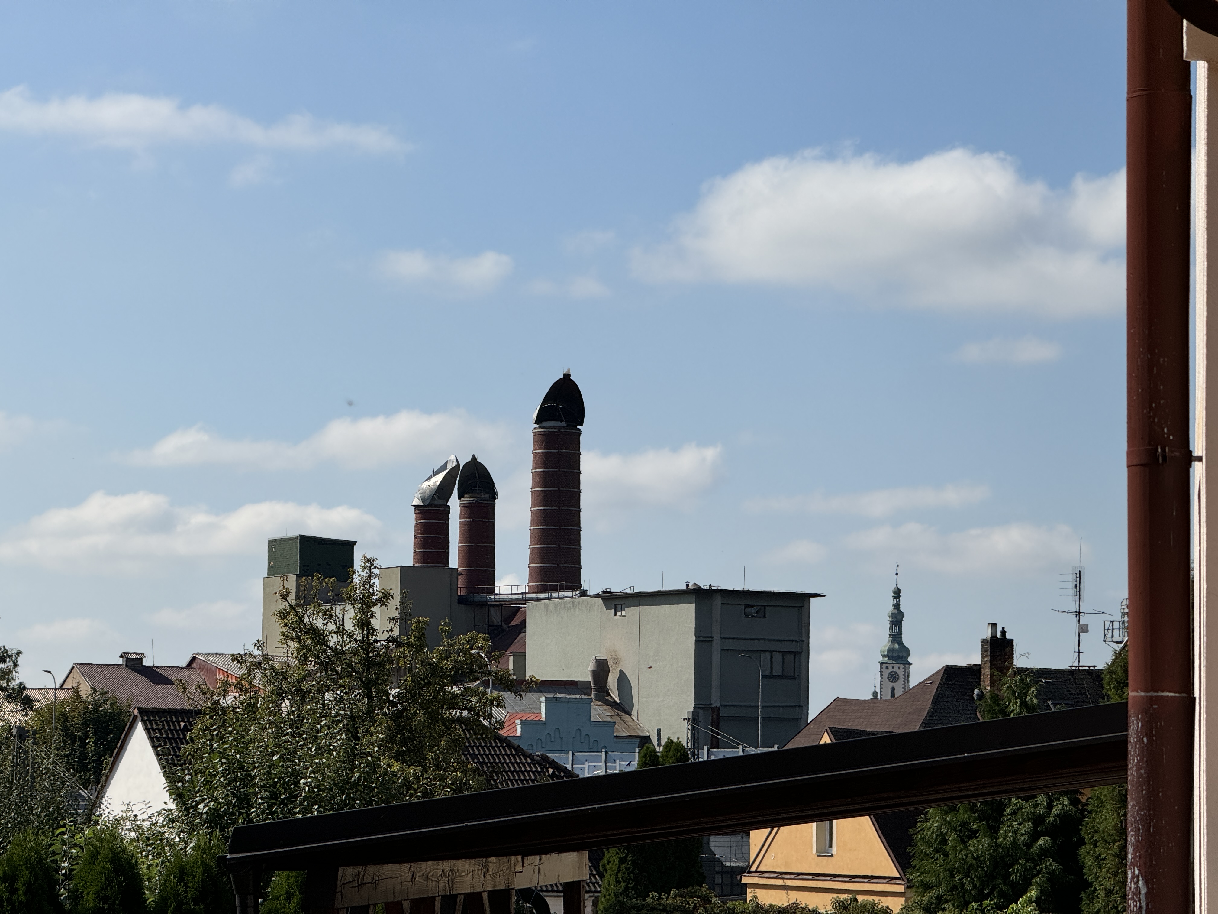 cityscape with chimneys and blue sky