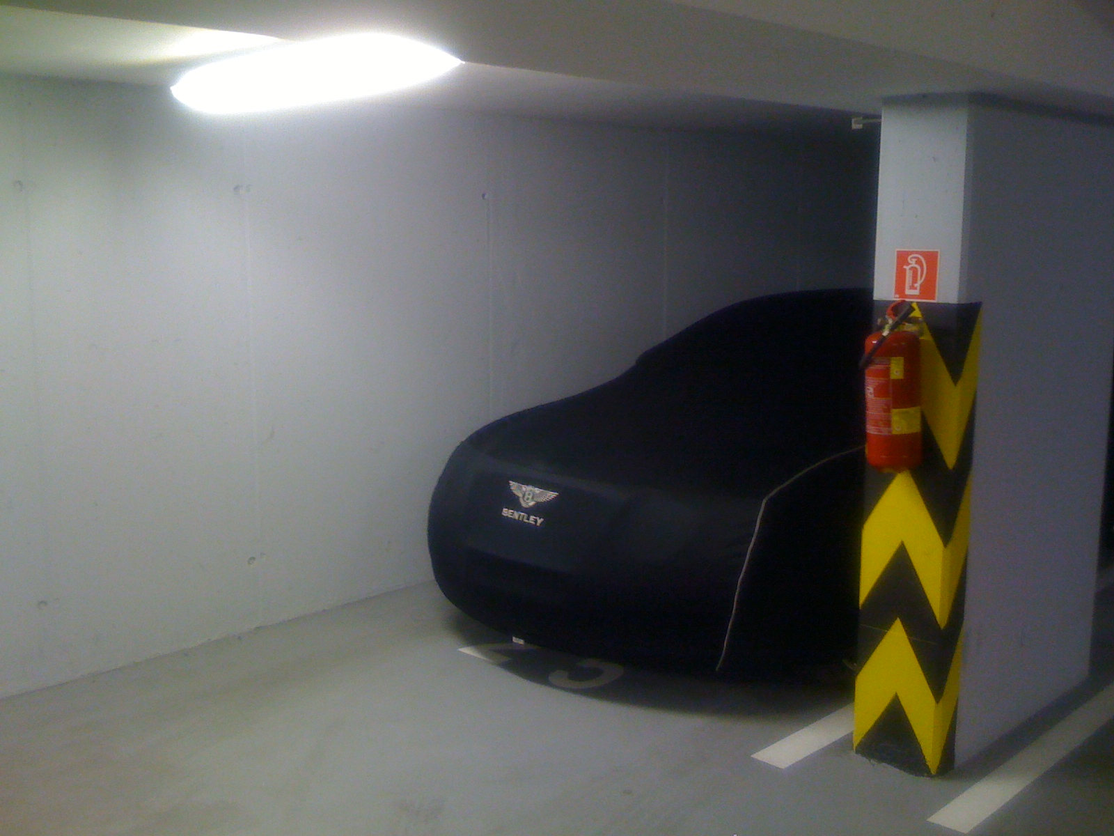 covered car in garage