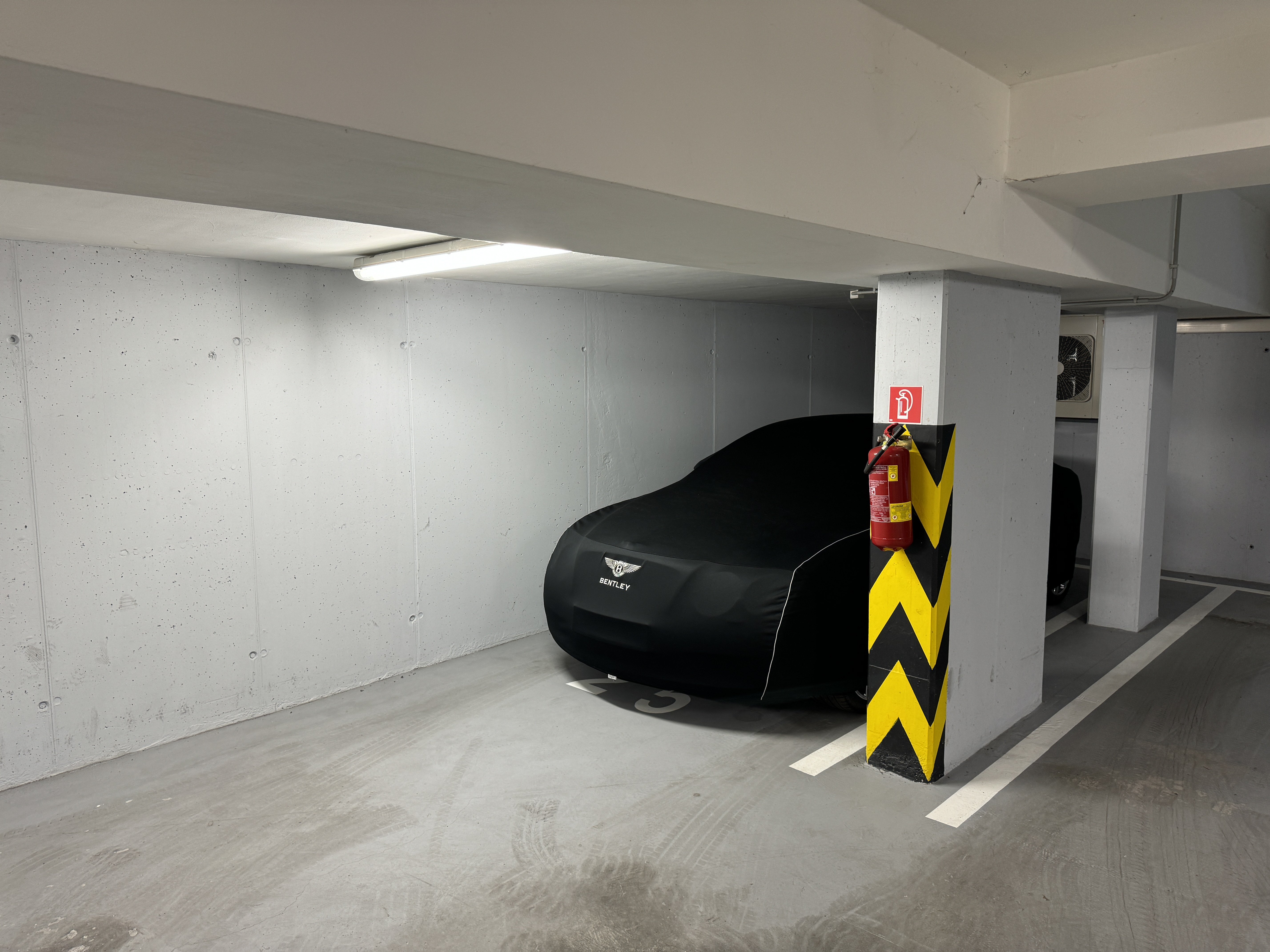 covered car in parking garage