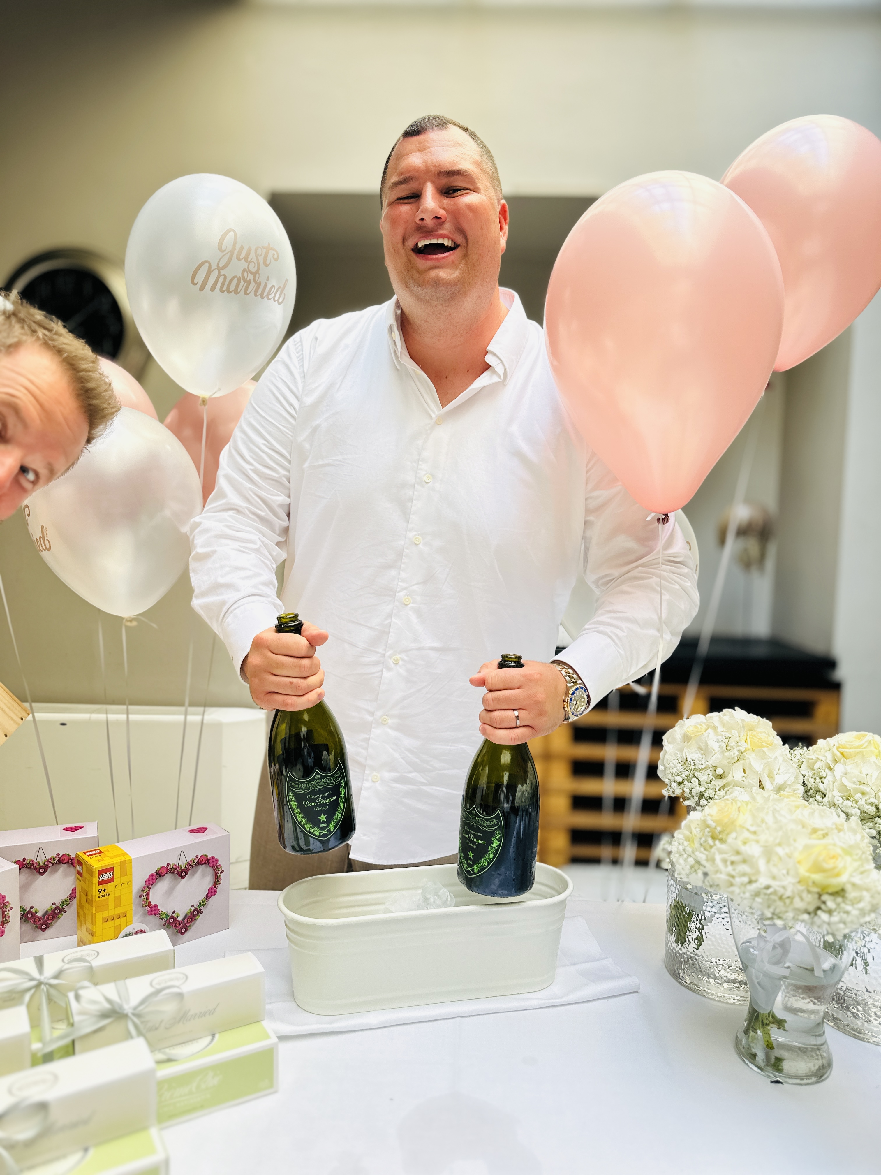 groom with champagne bottles