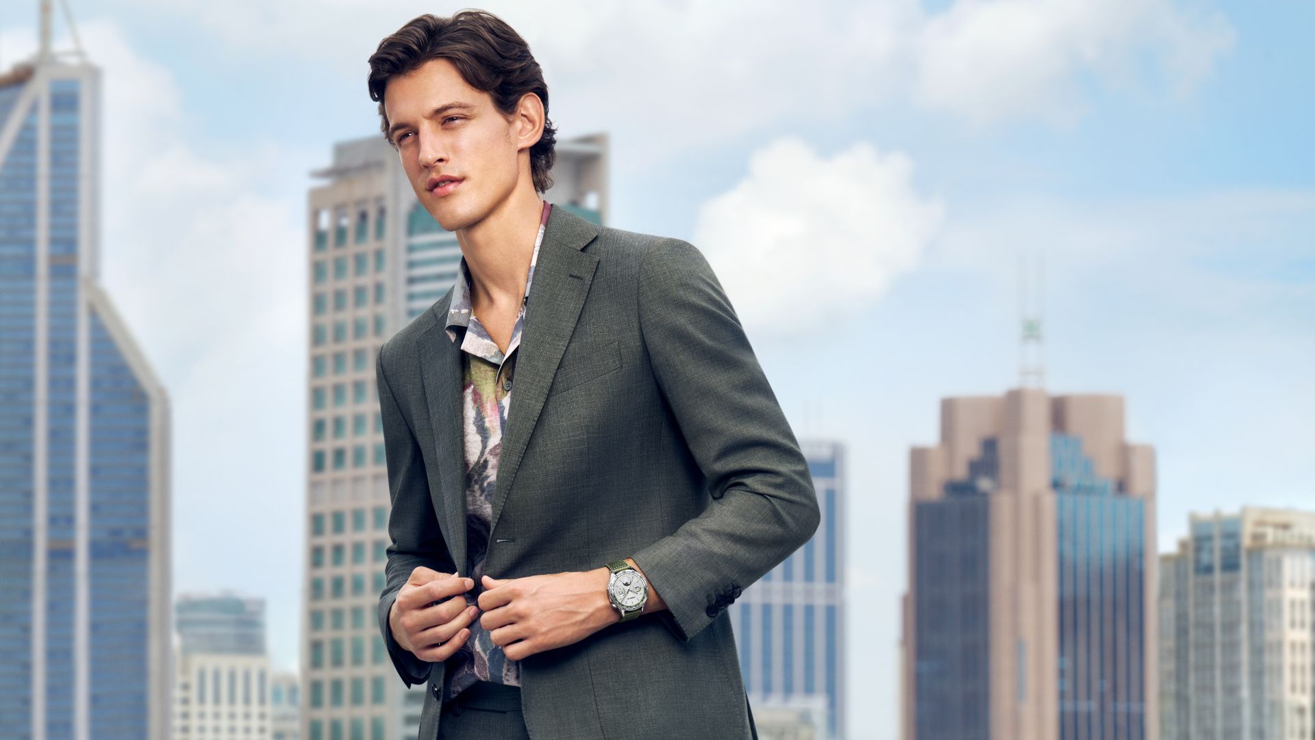 man in suit with watch