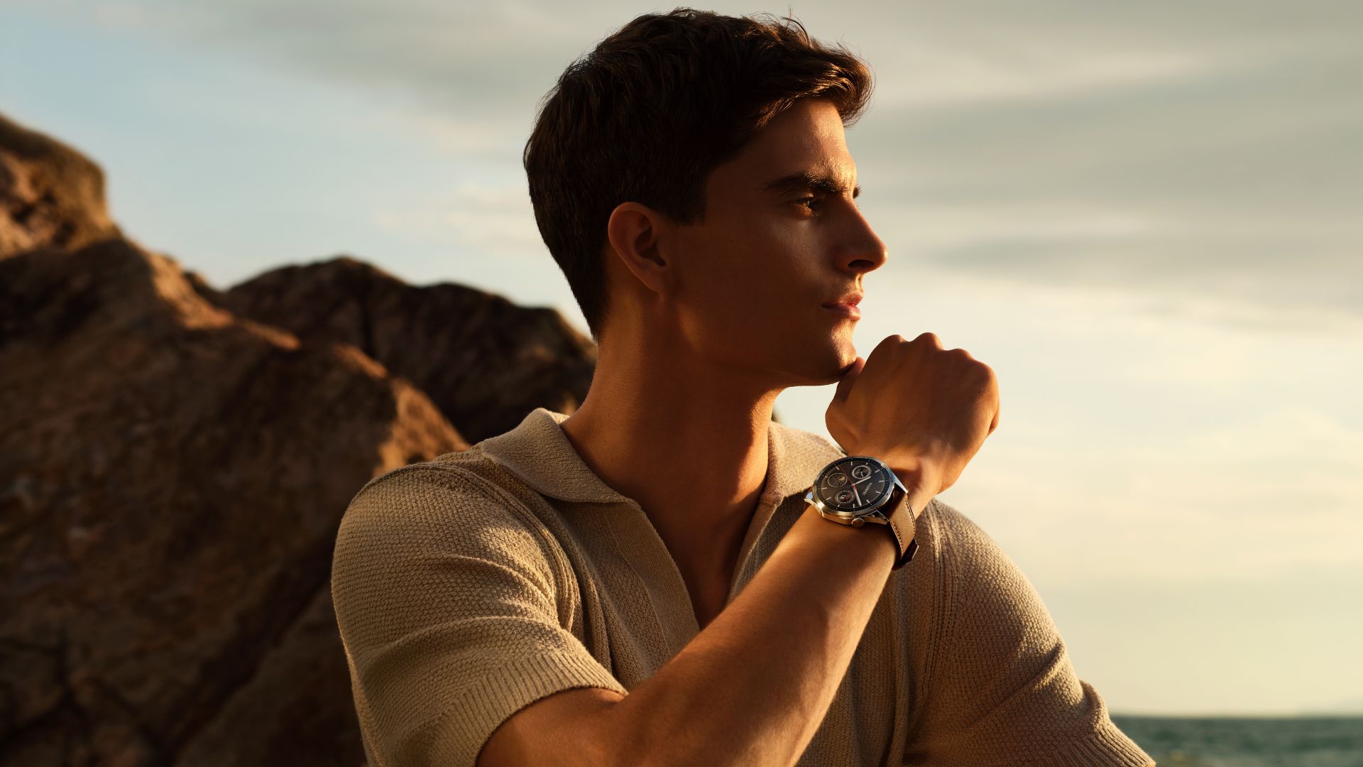 man wearing watch outdoors