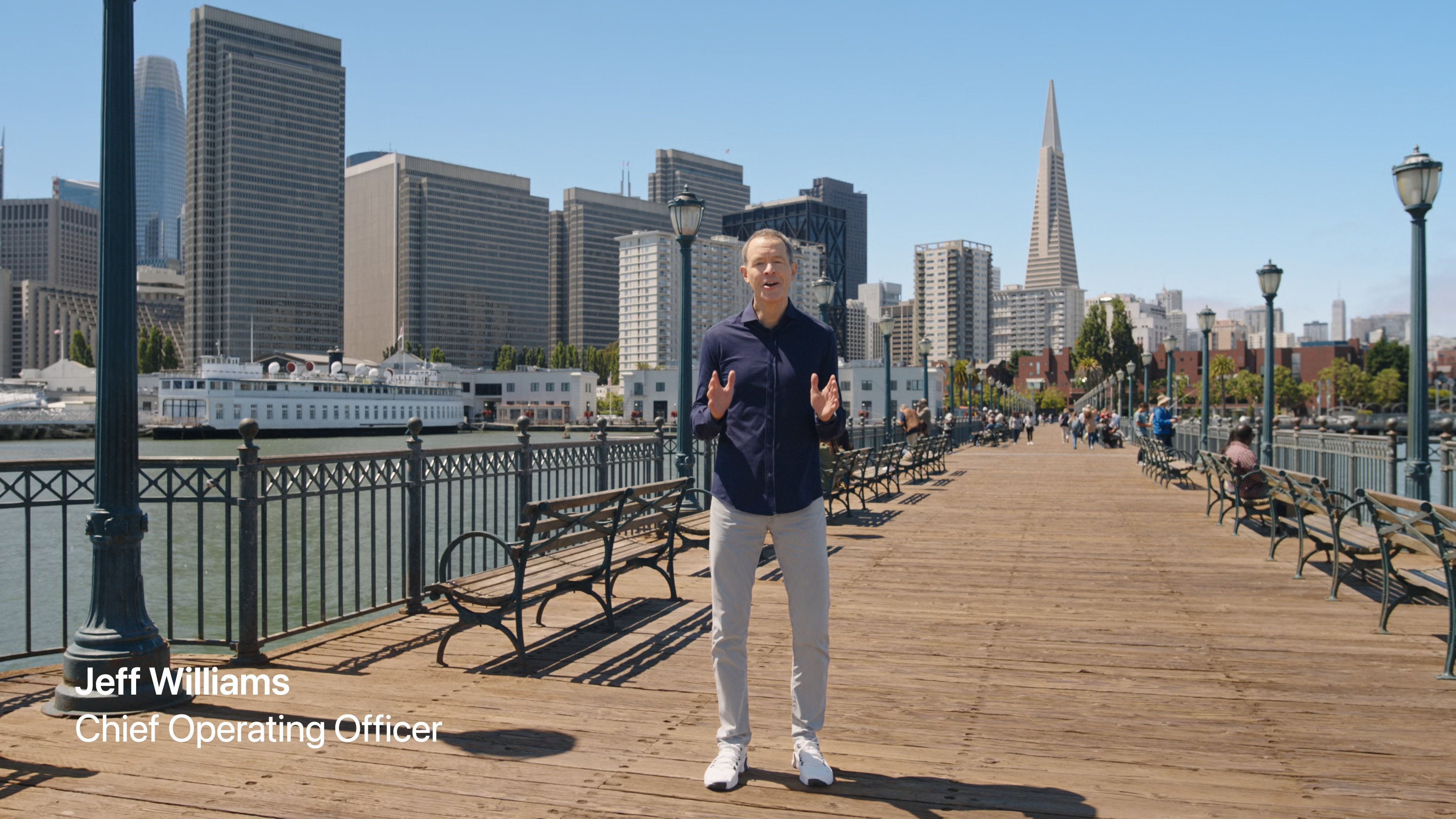 person on pier cityscape