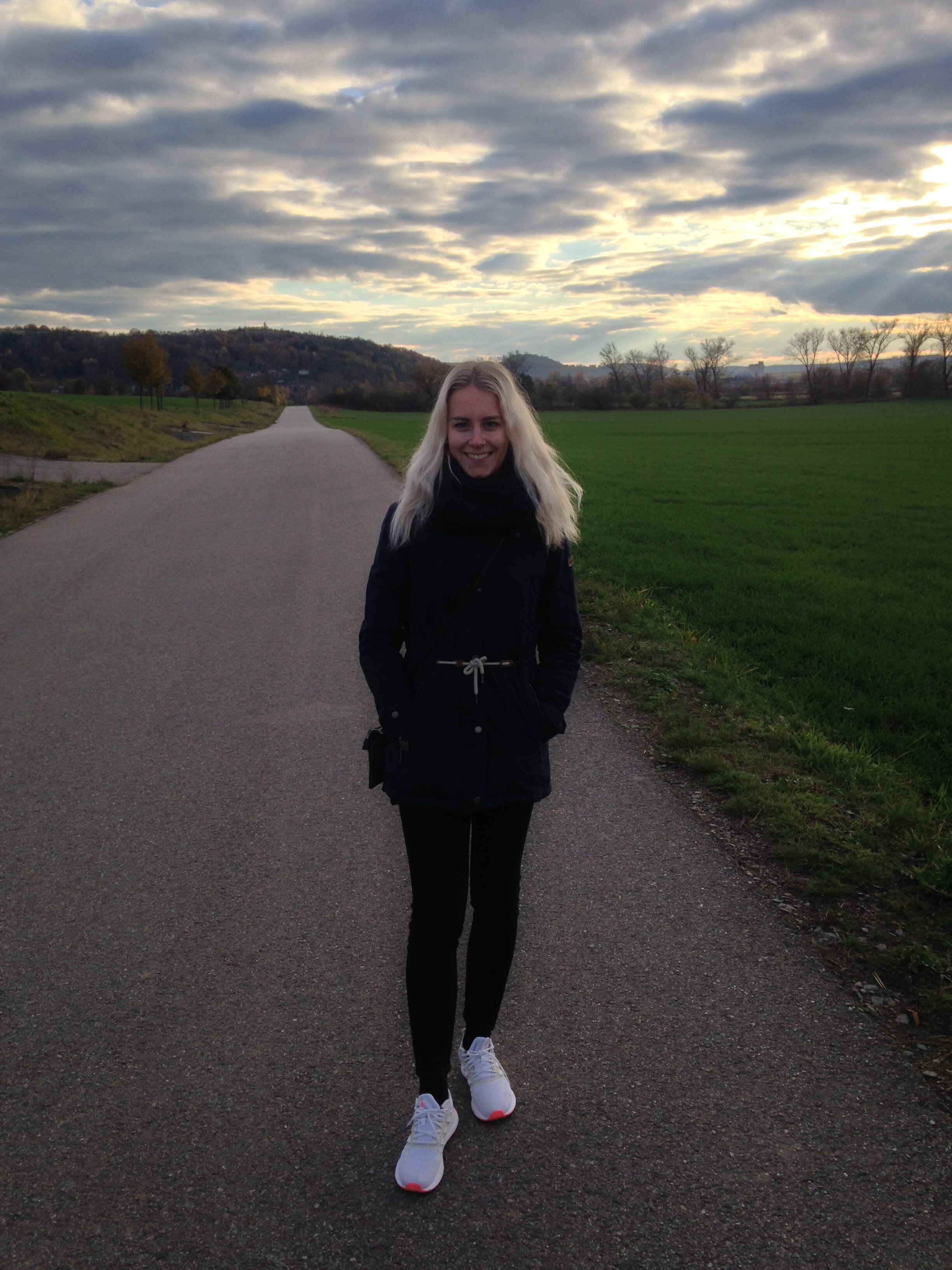 person standing on road