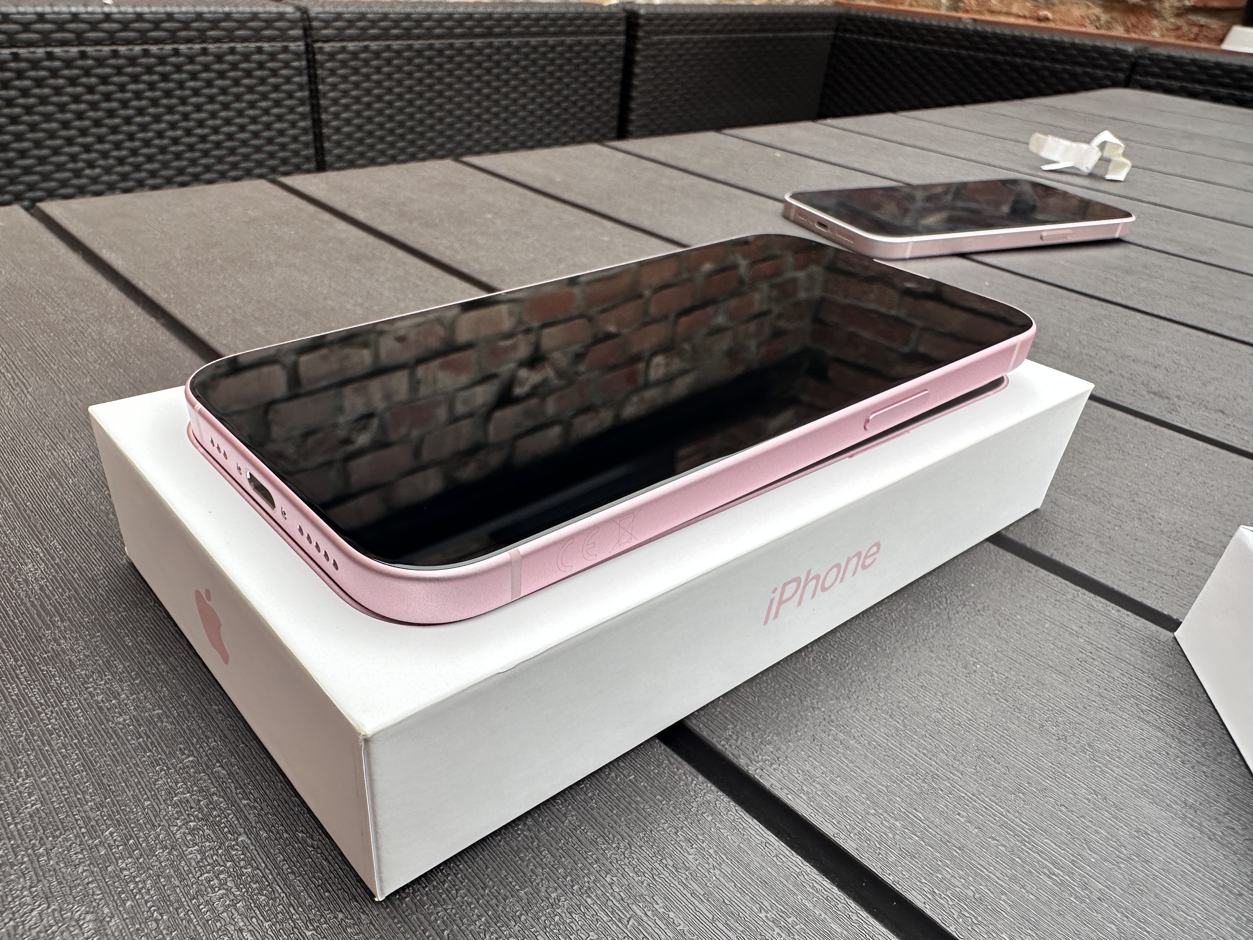 pink iphone on box