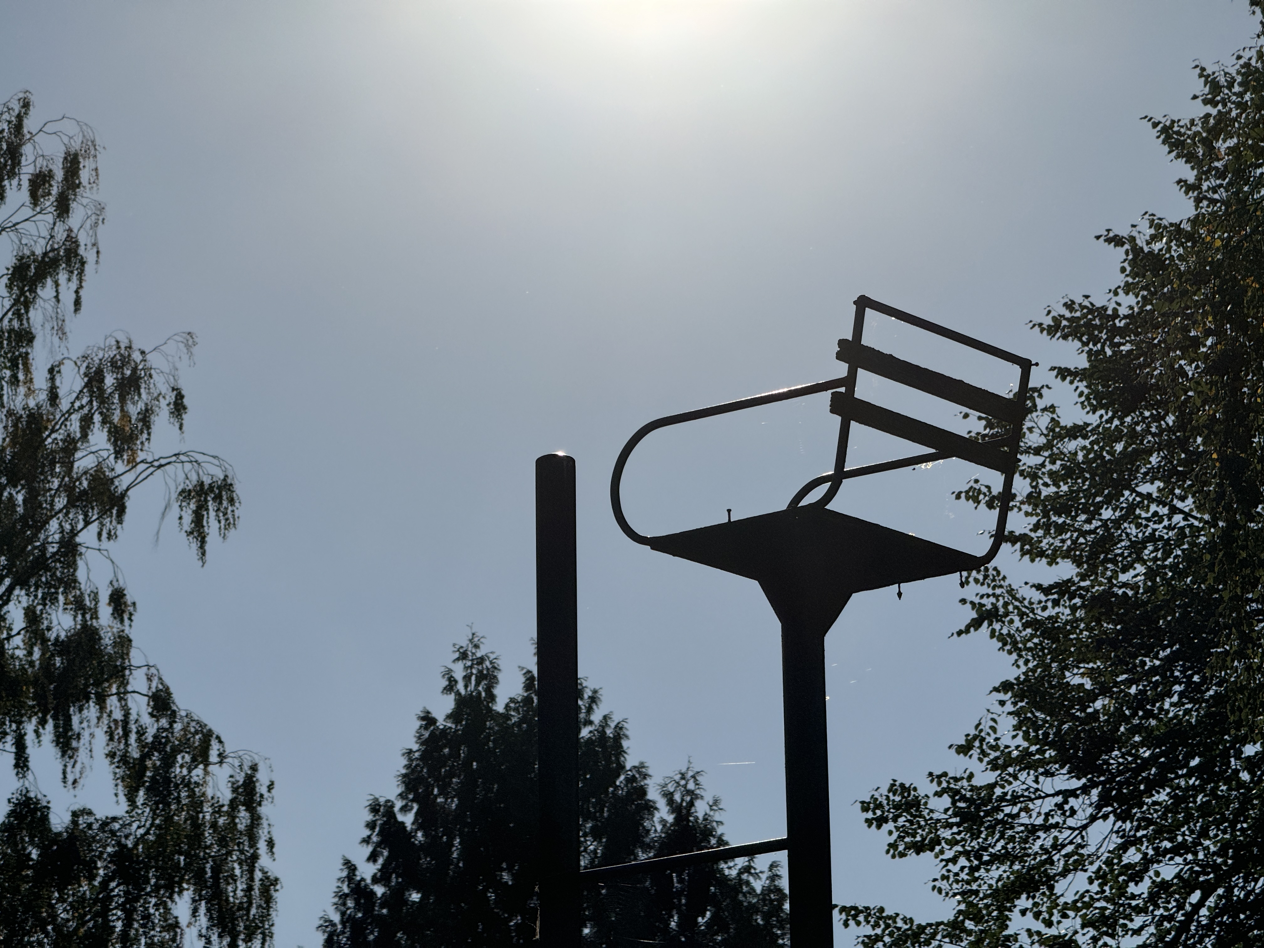 playground structure silhouette sun