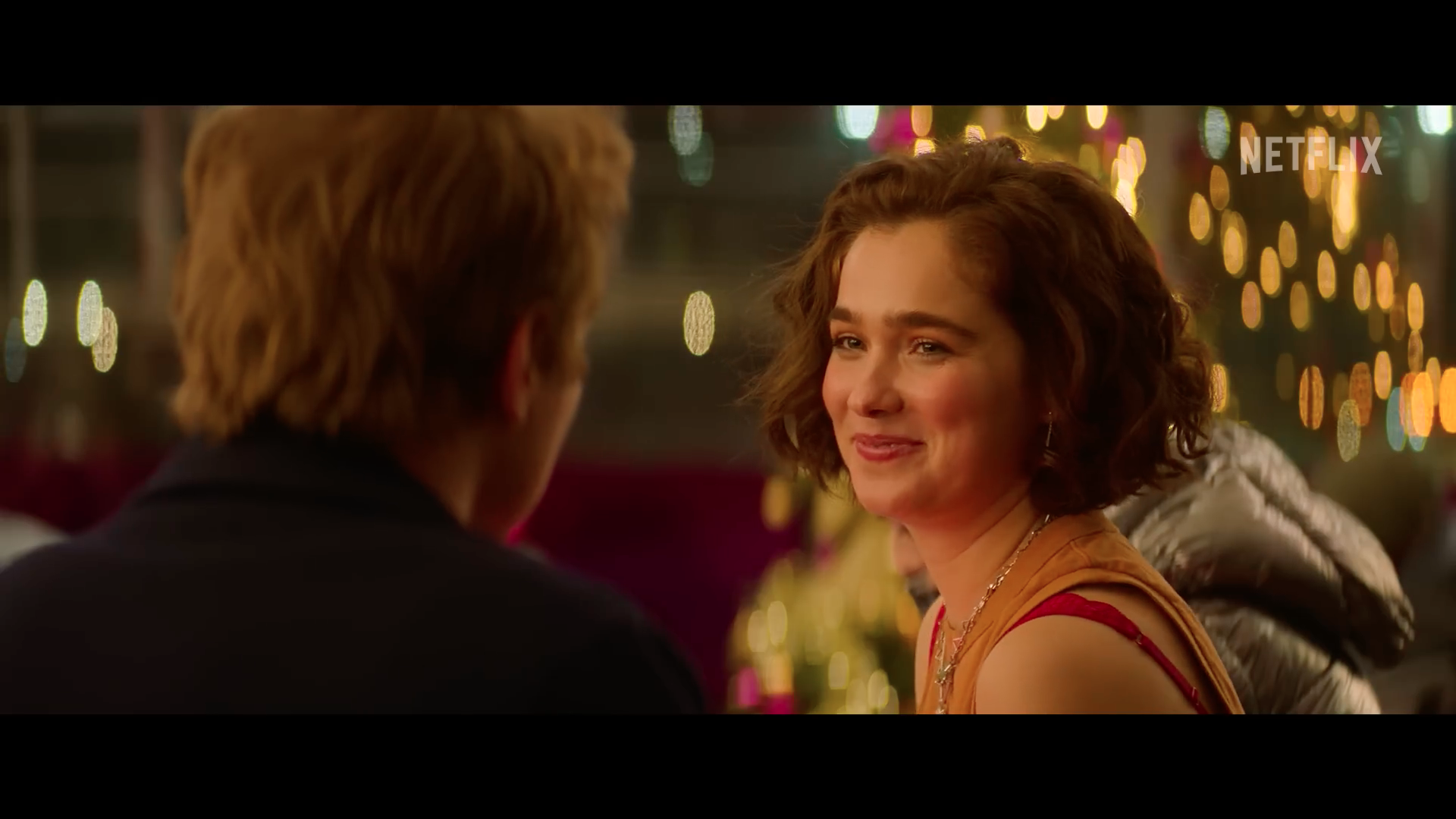 smiling woman festive lights