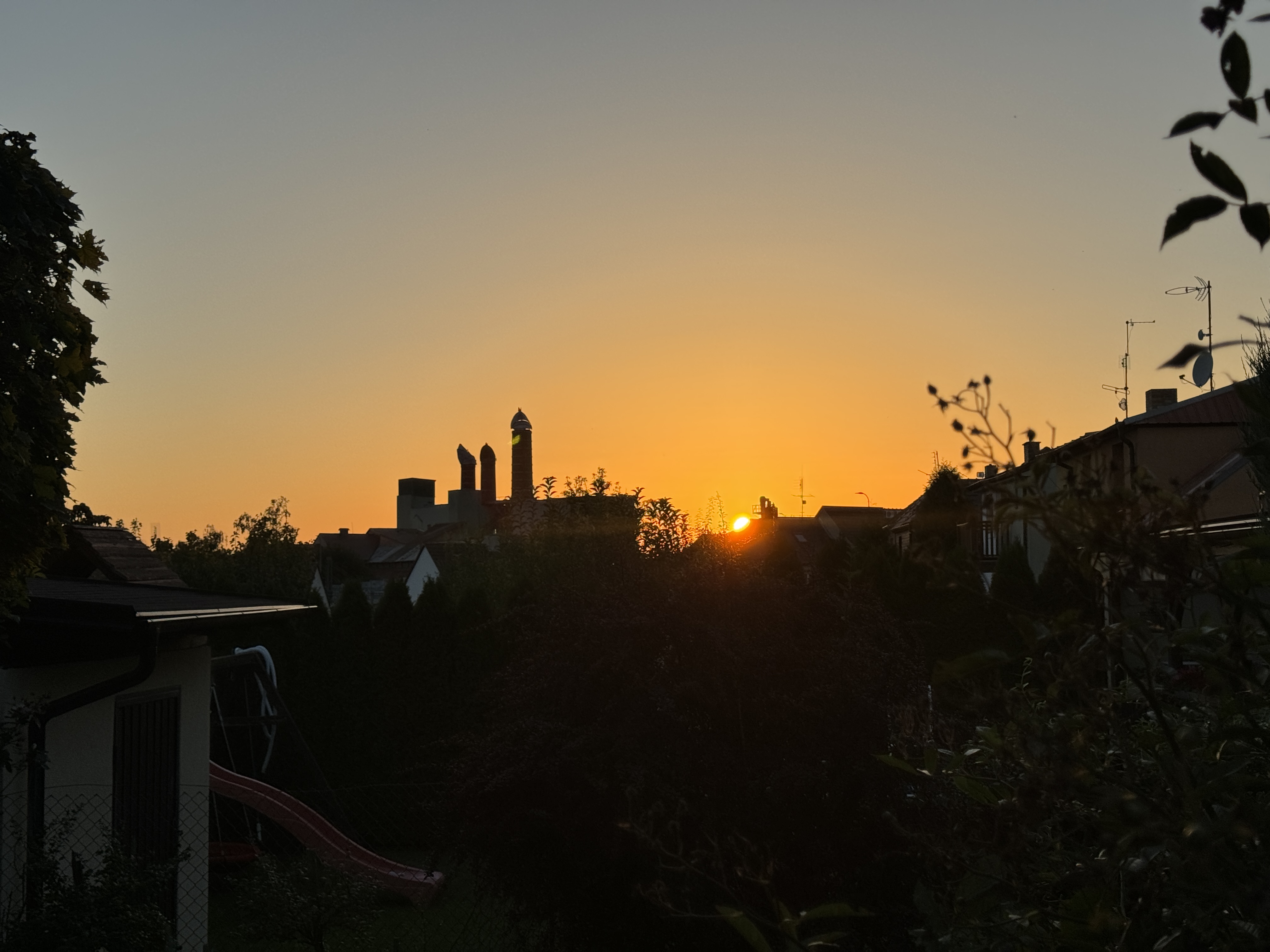 sunset over houses