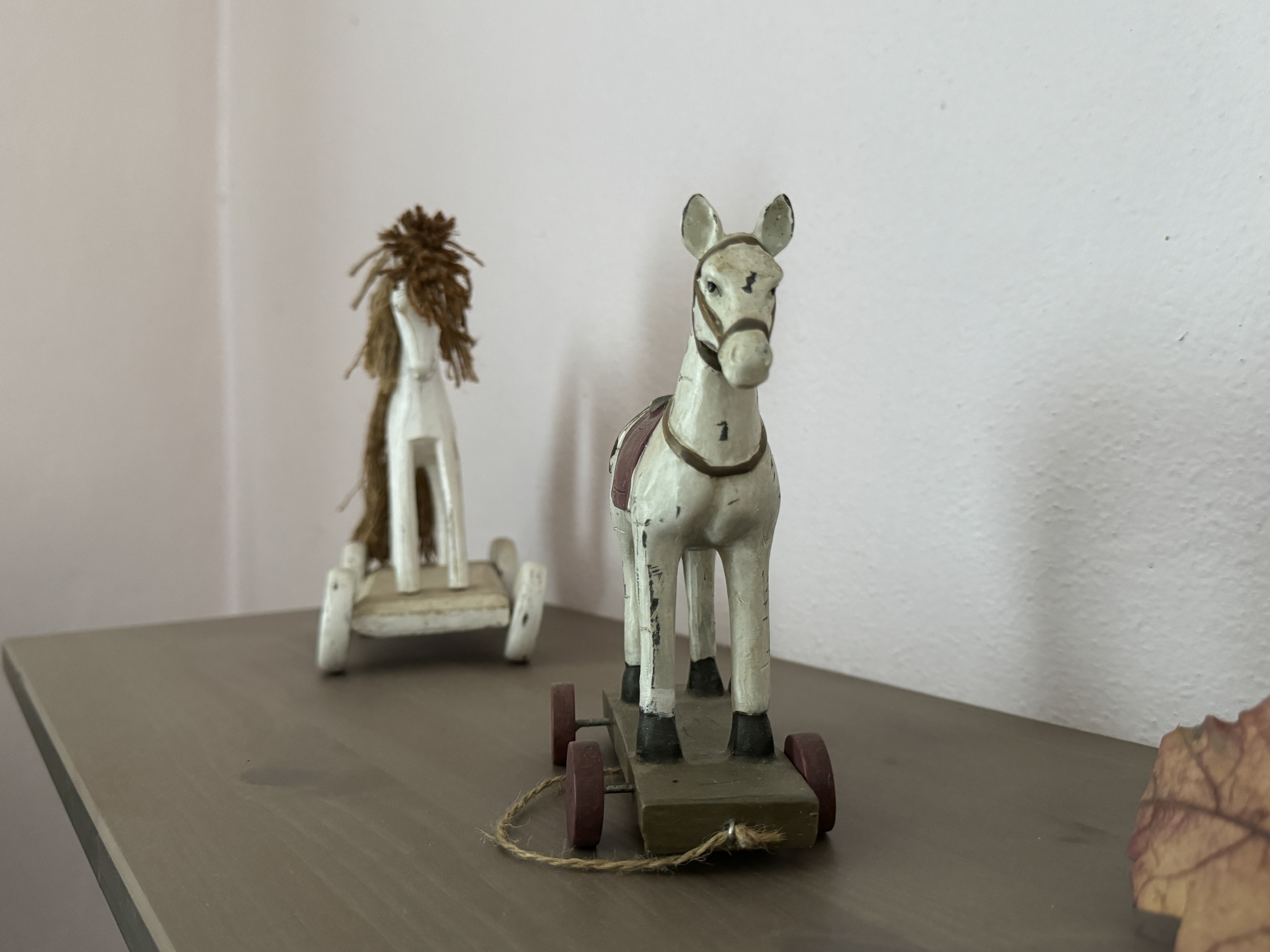 wooden horse figurine on shelf