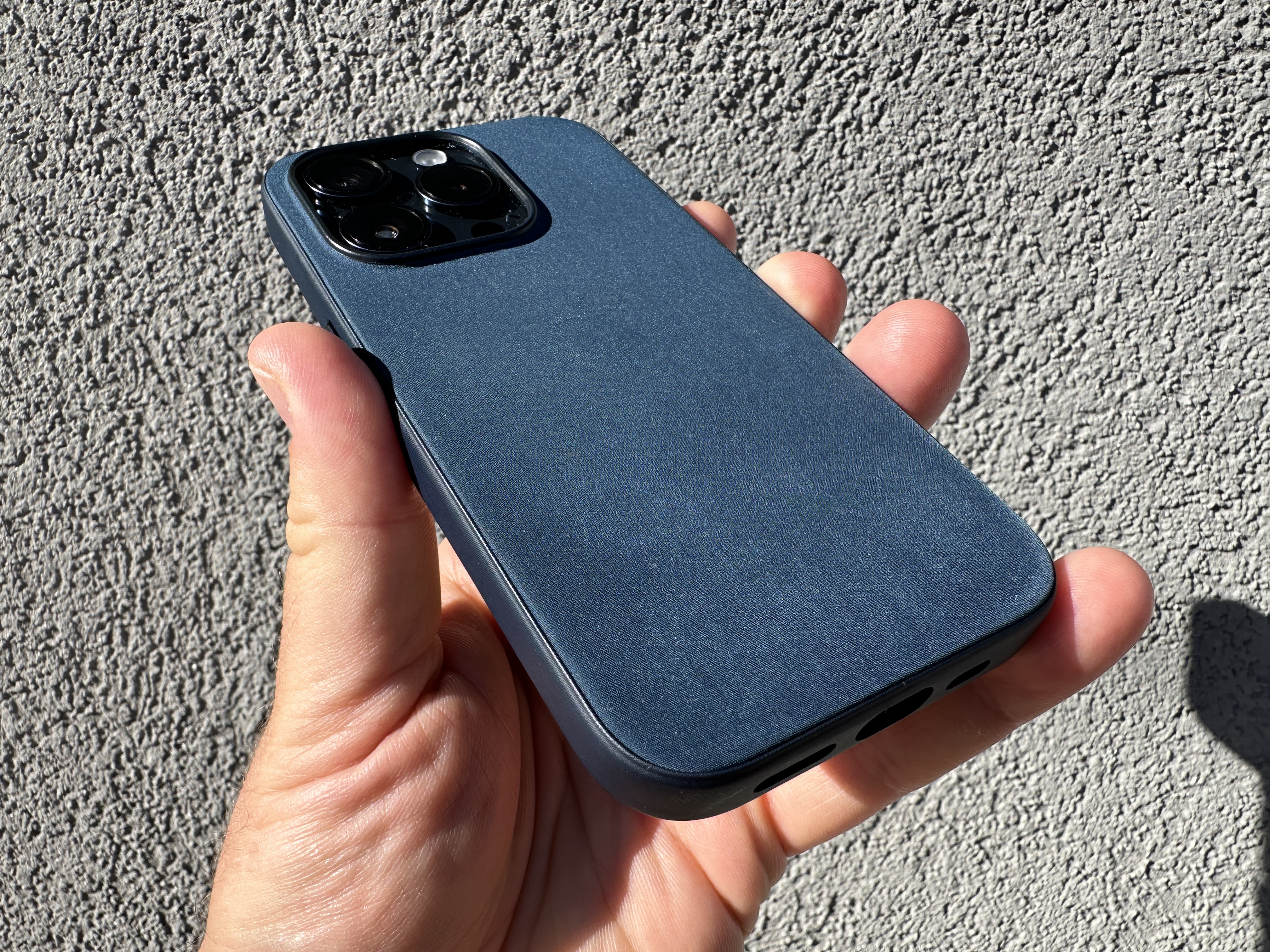 hand holding blue phone case