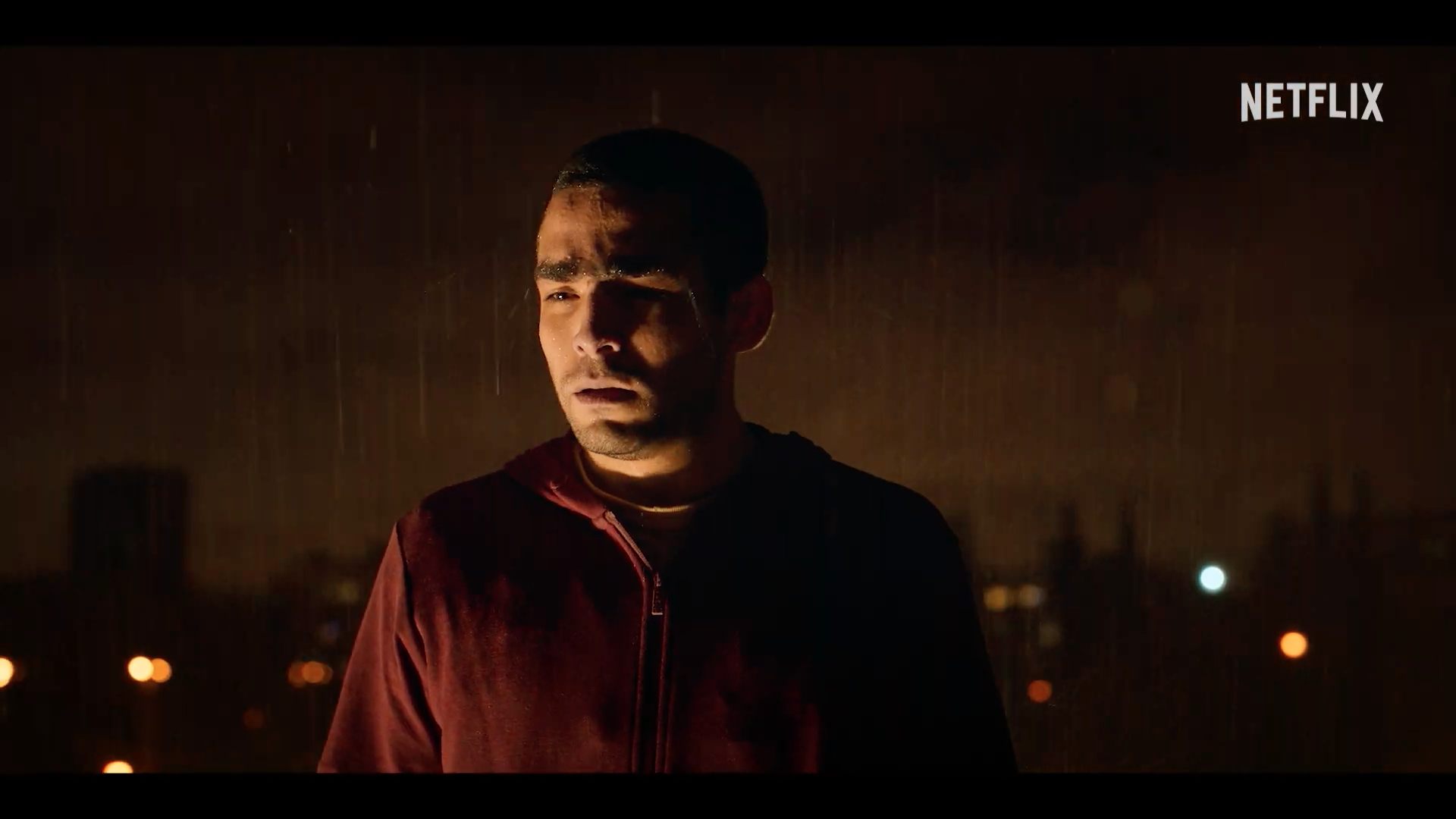 man standing in rain