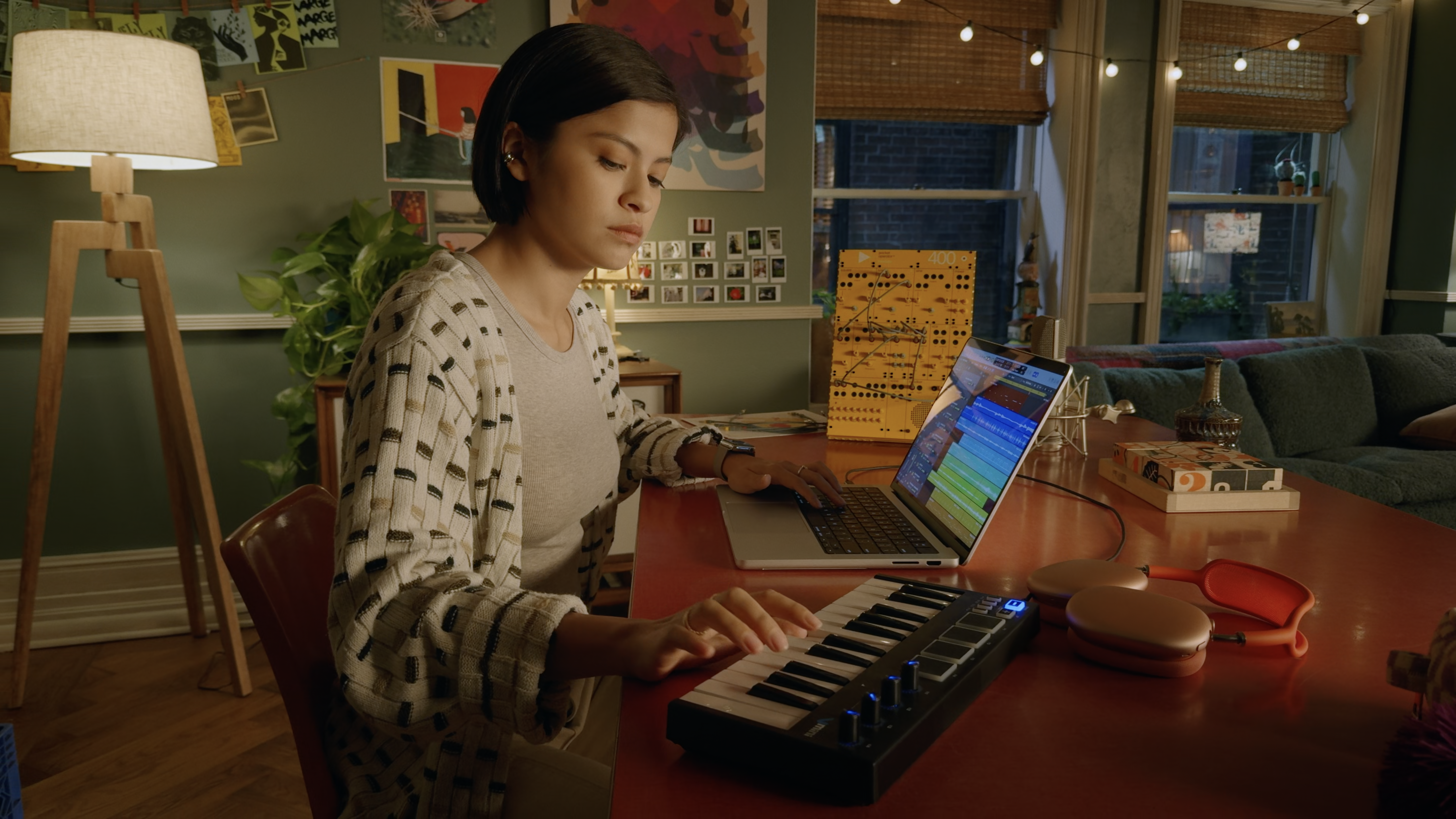person using macbook with keyboard