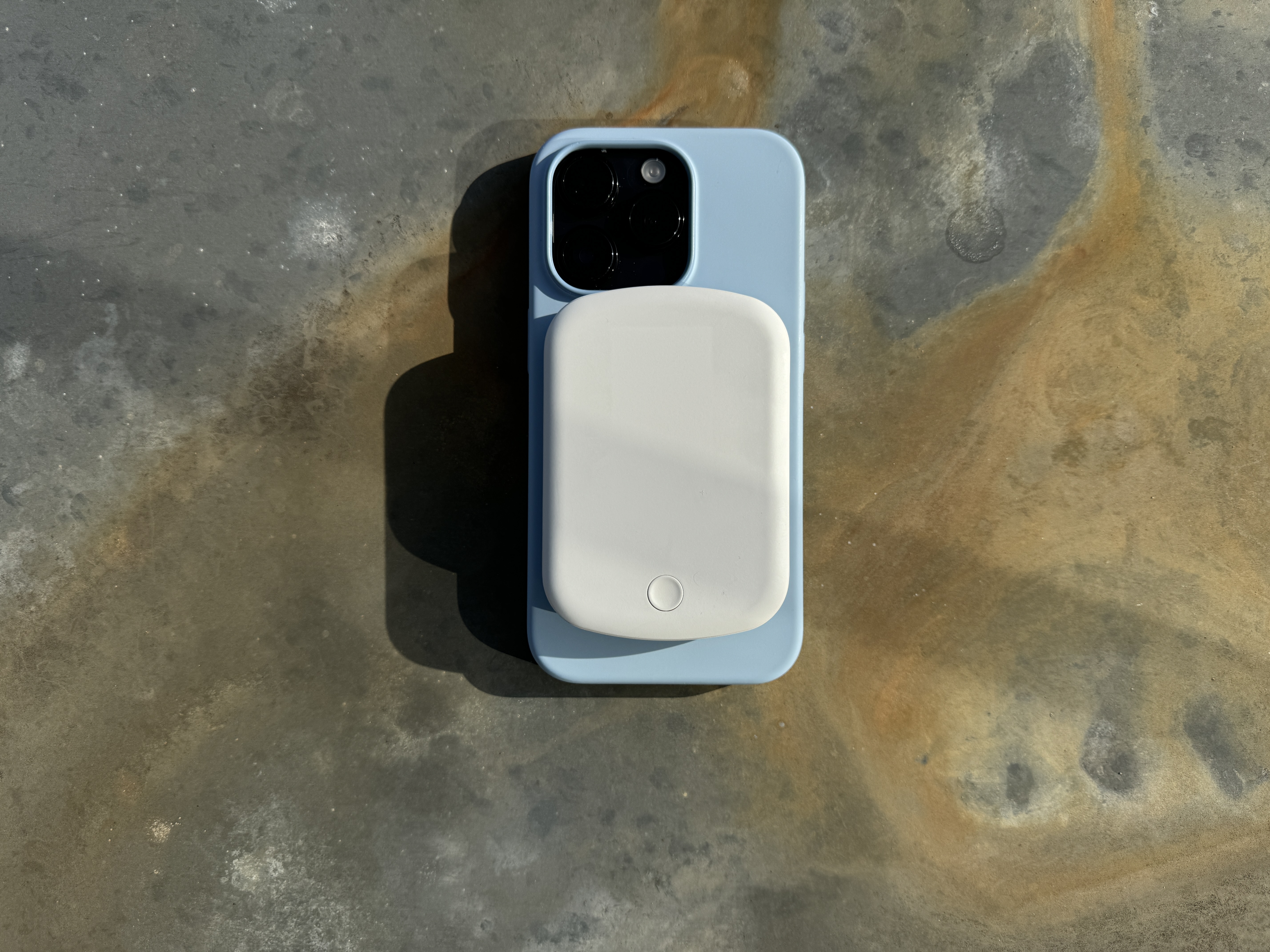 phone and earbuds on charging stand