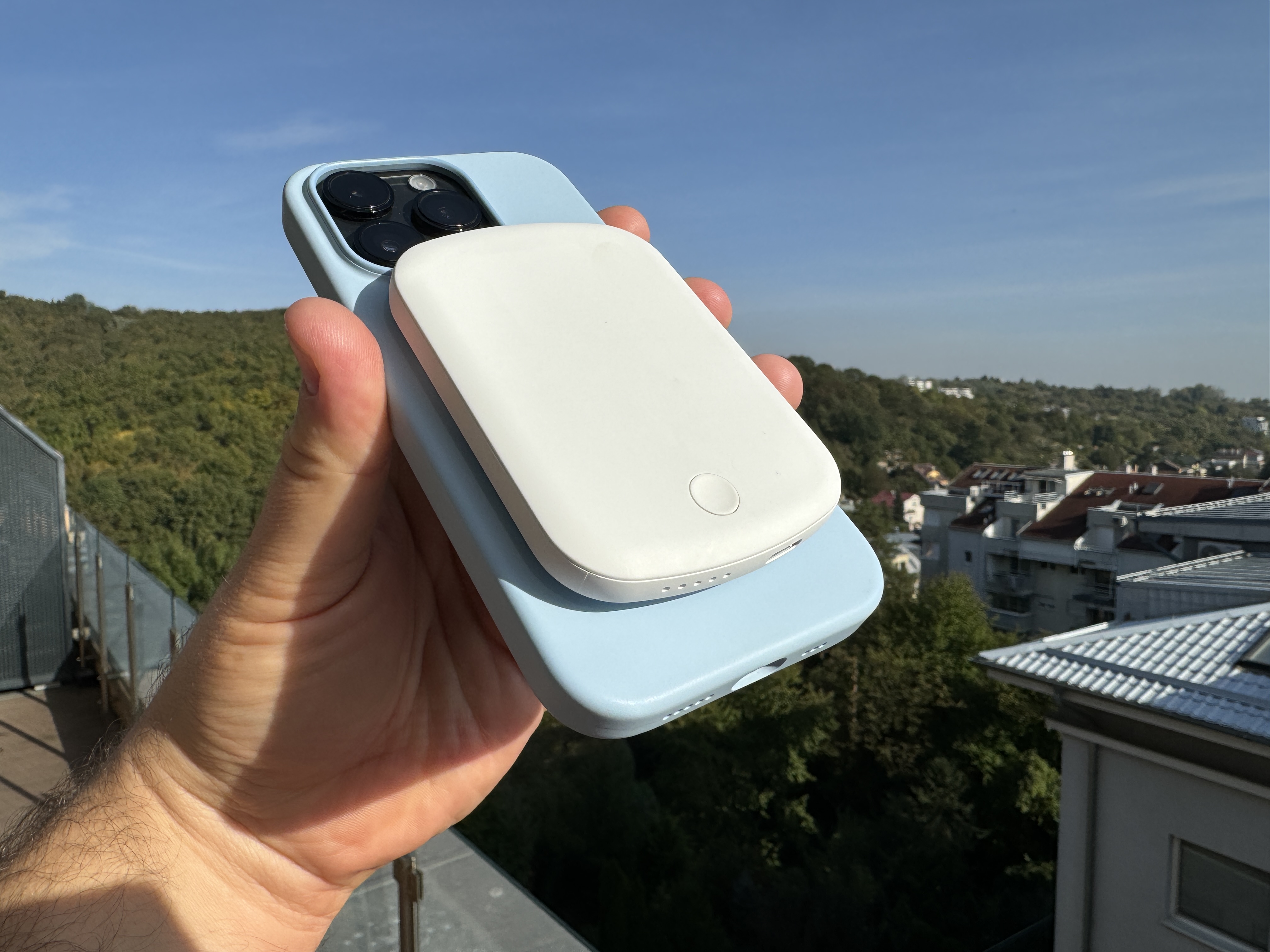 phone with battery pack in hand