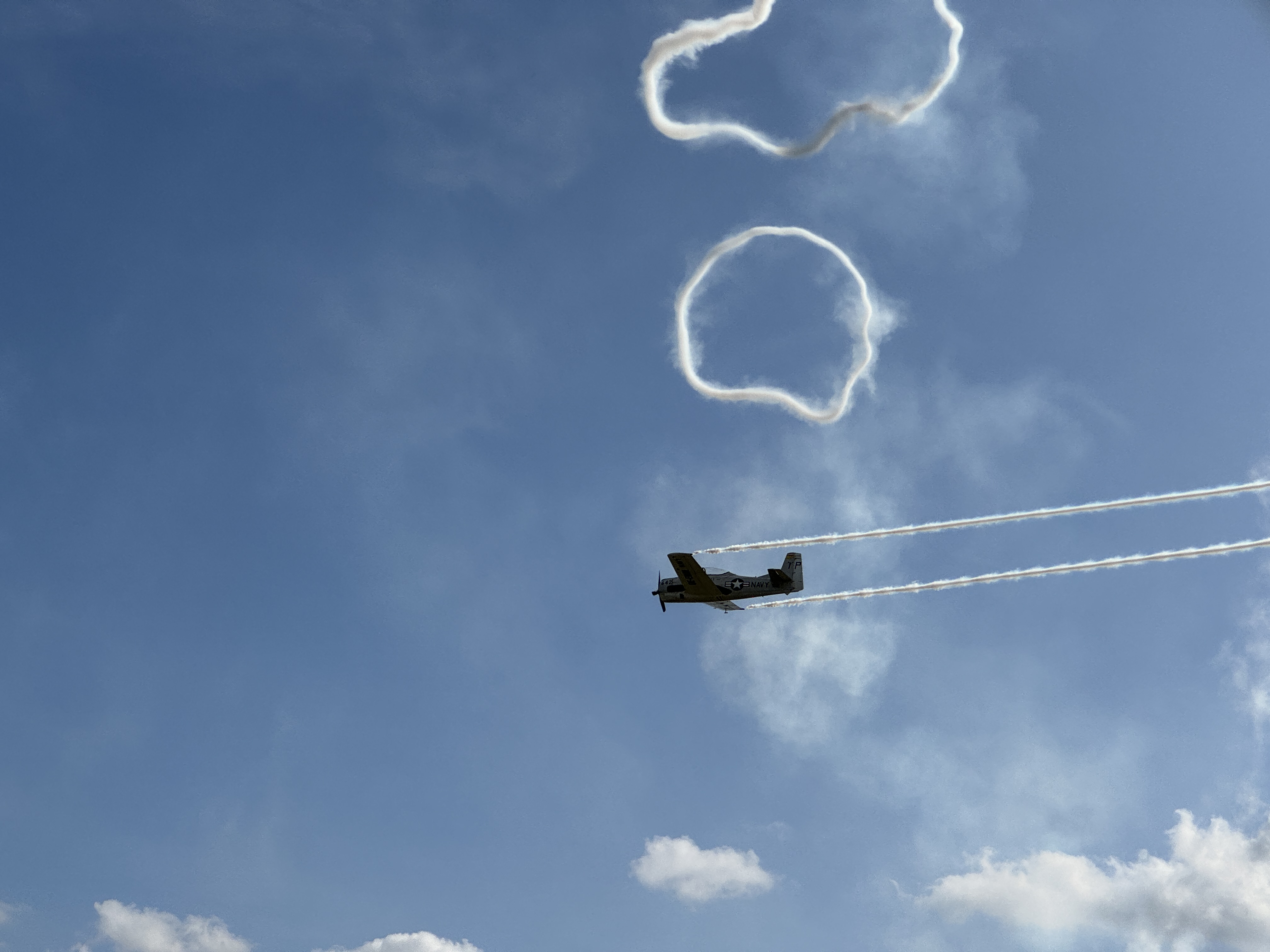 plane with smoke rings