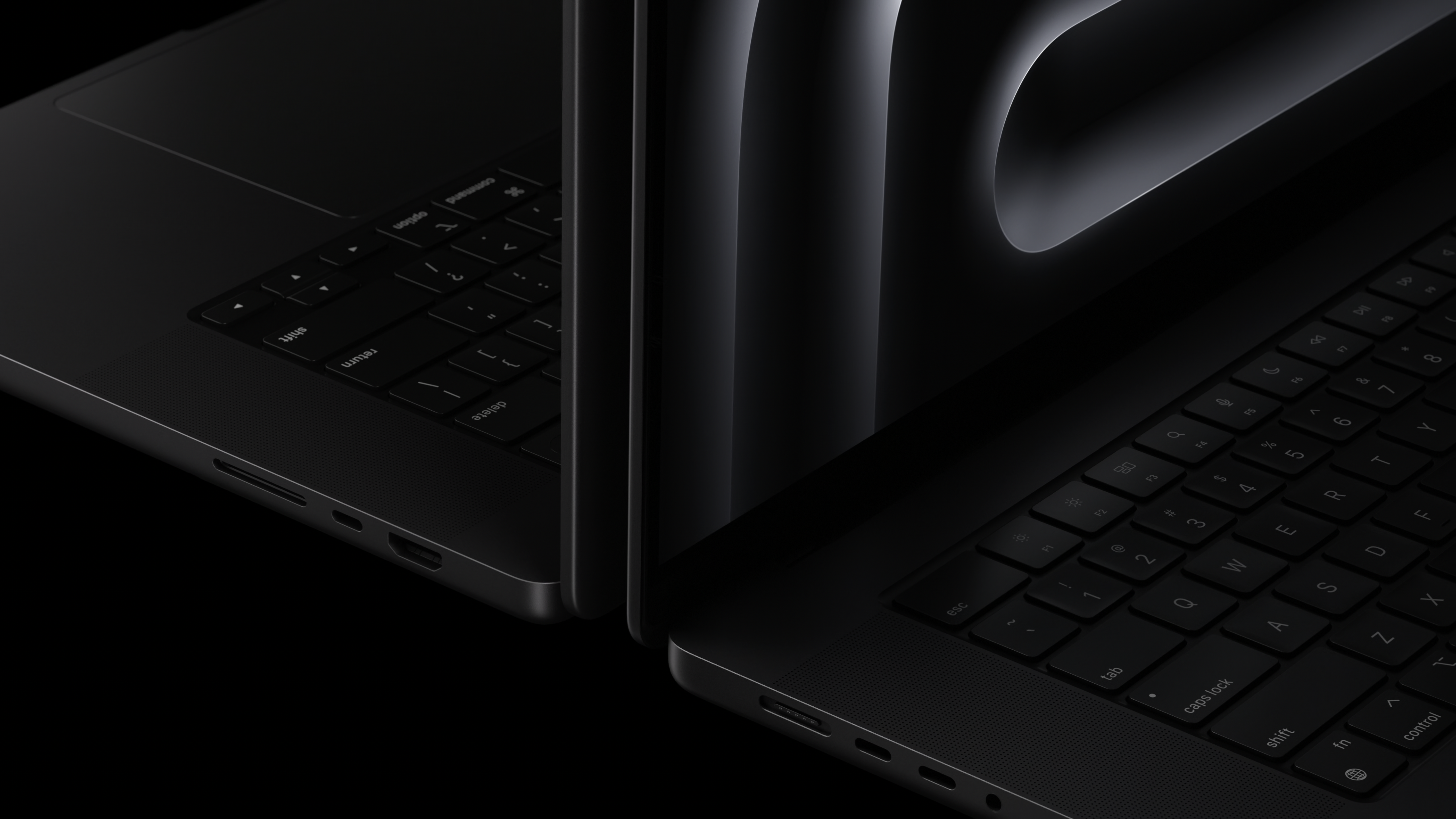 two black laptops side view
