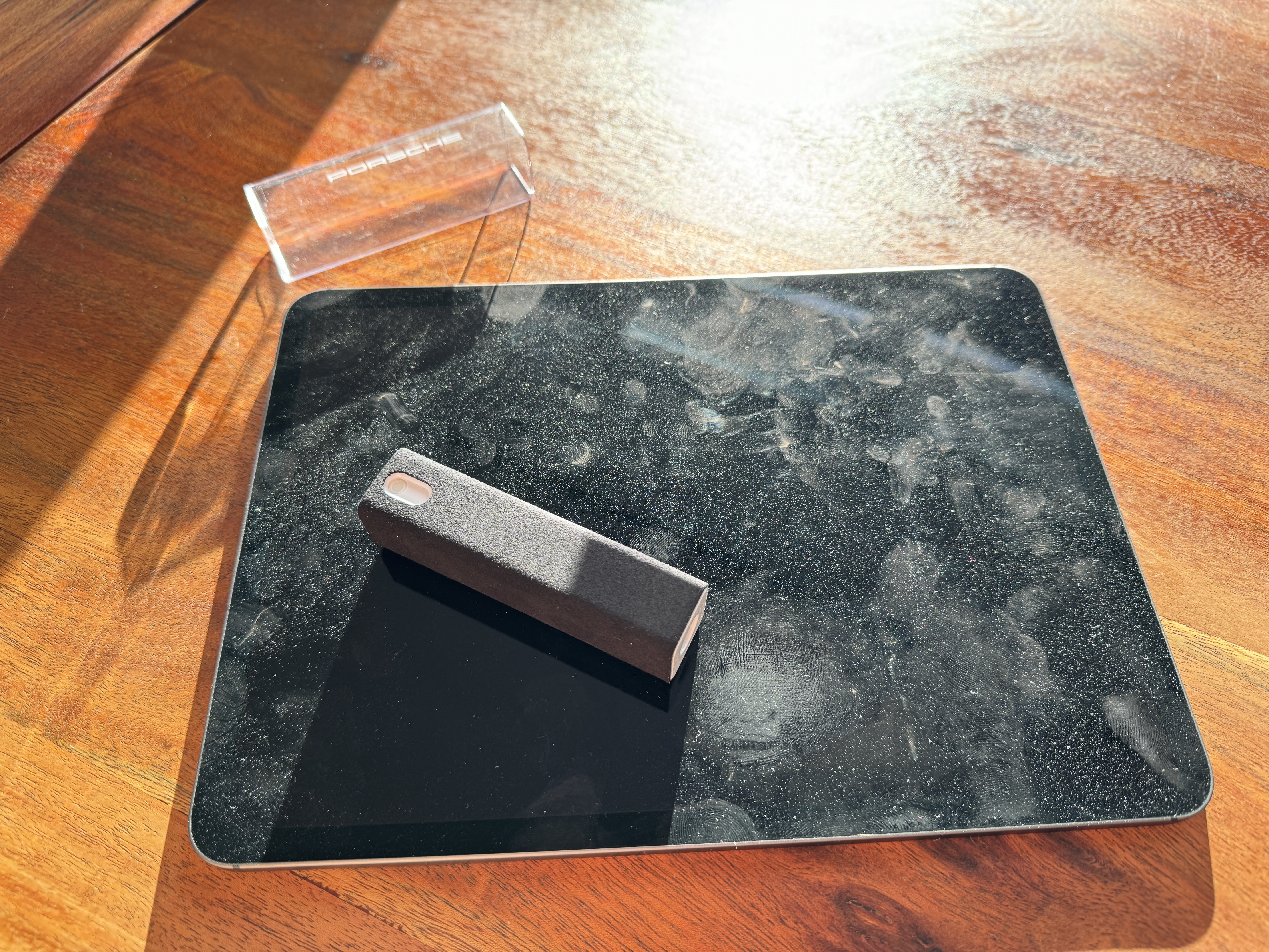 black mousepad on wooden table