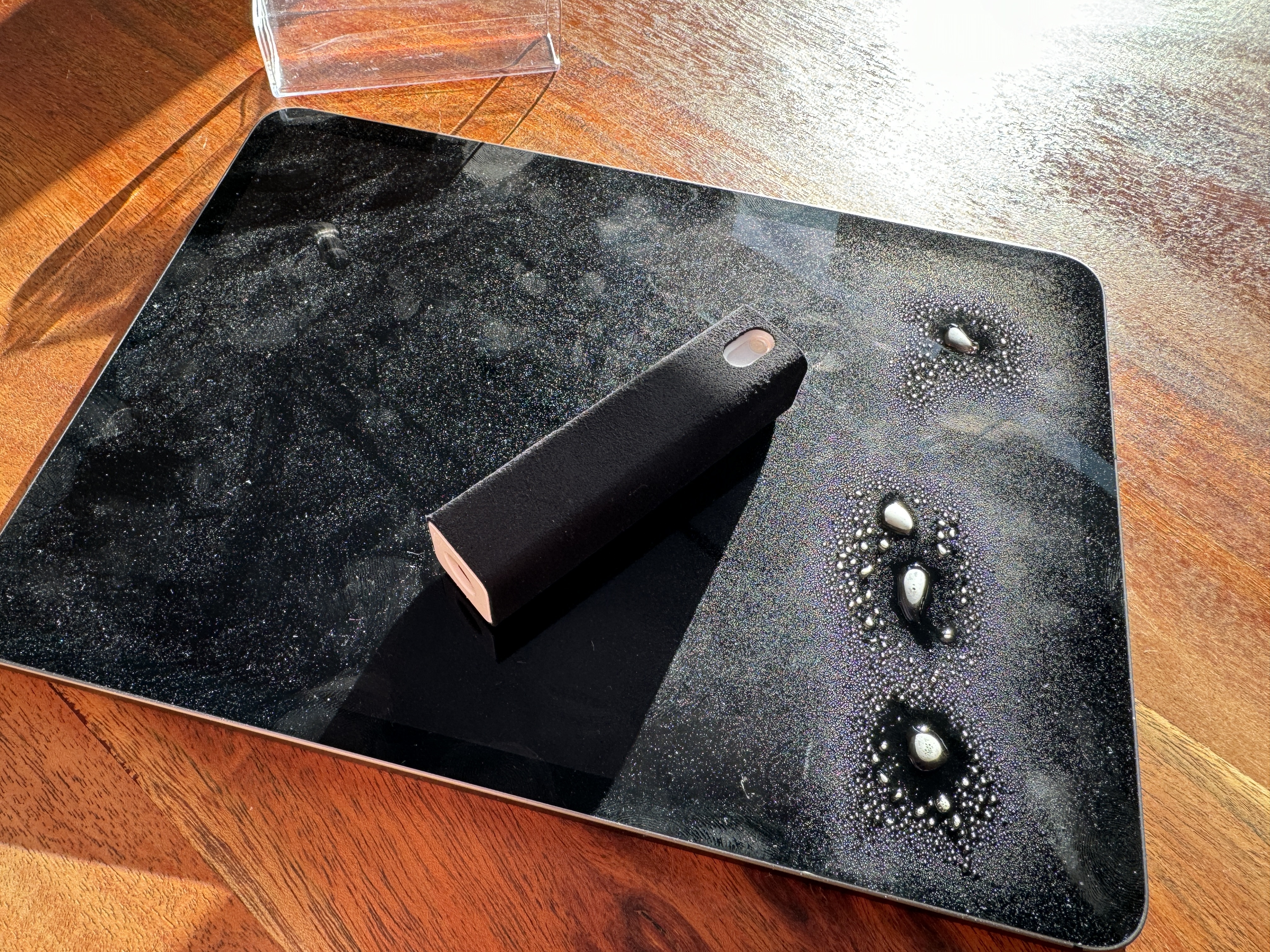 black tablet with dust and device