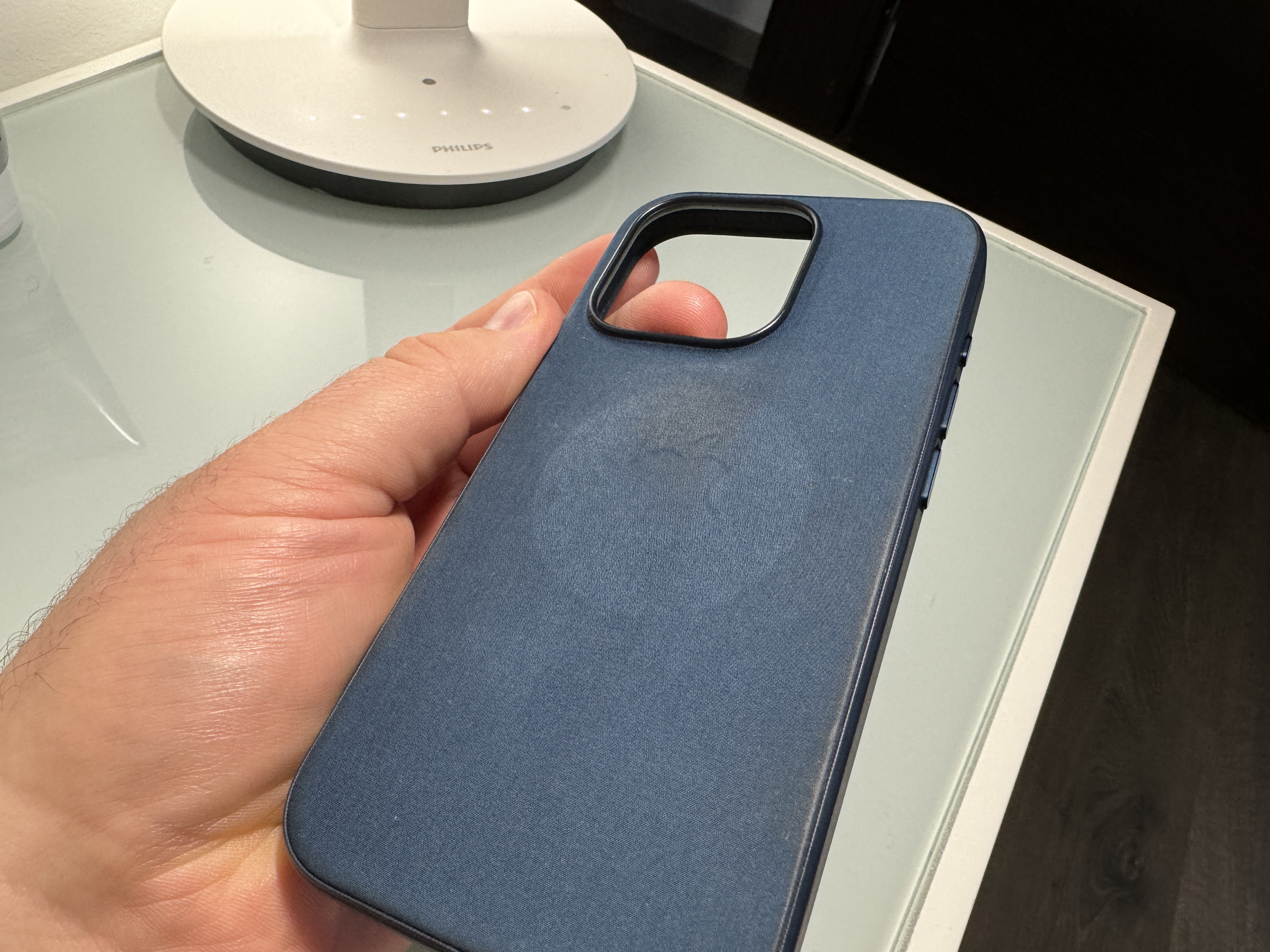 hand holding blue phone case