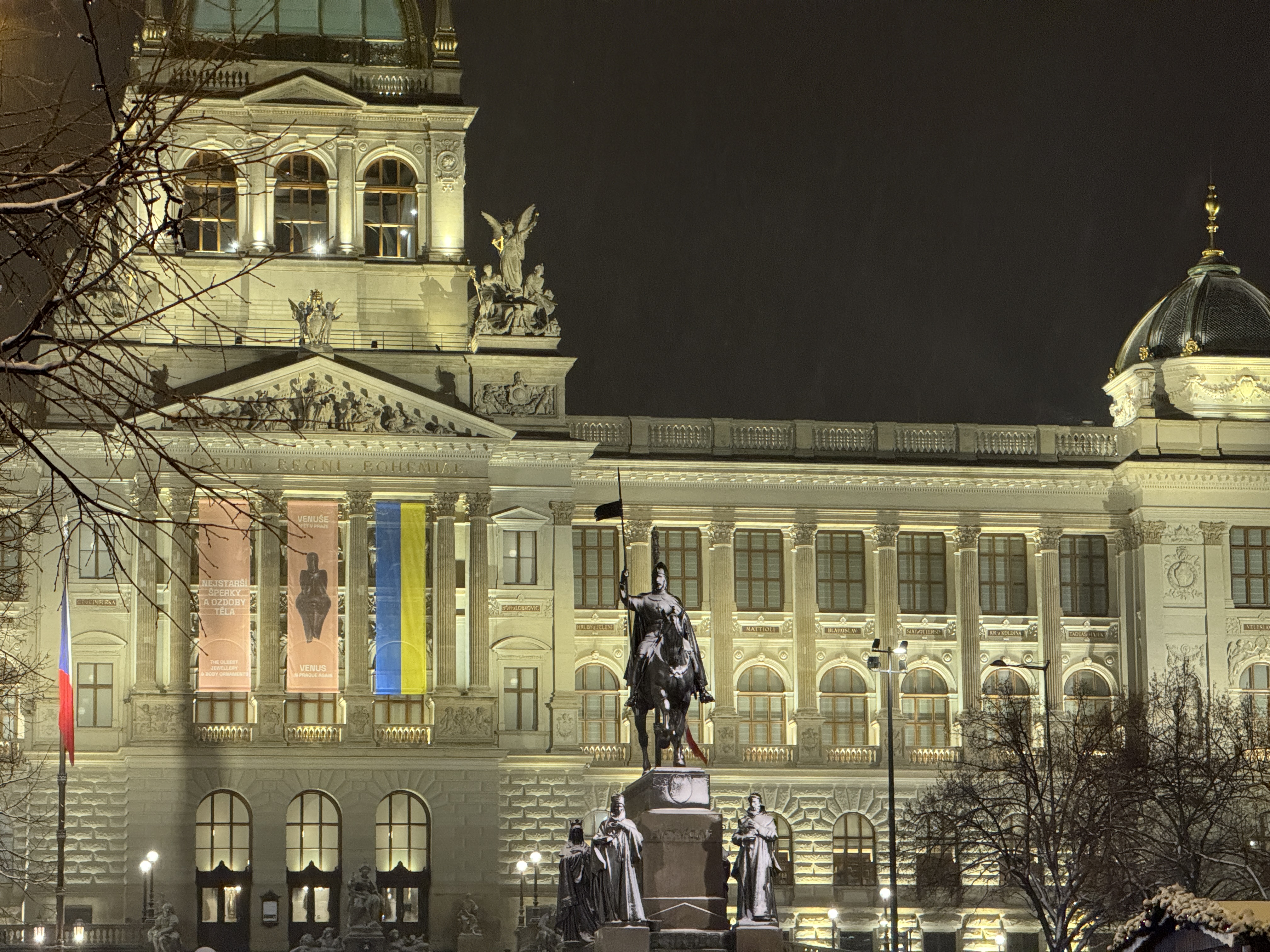 illuminated building statue night